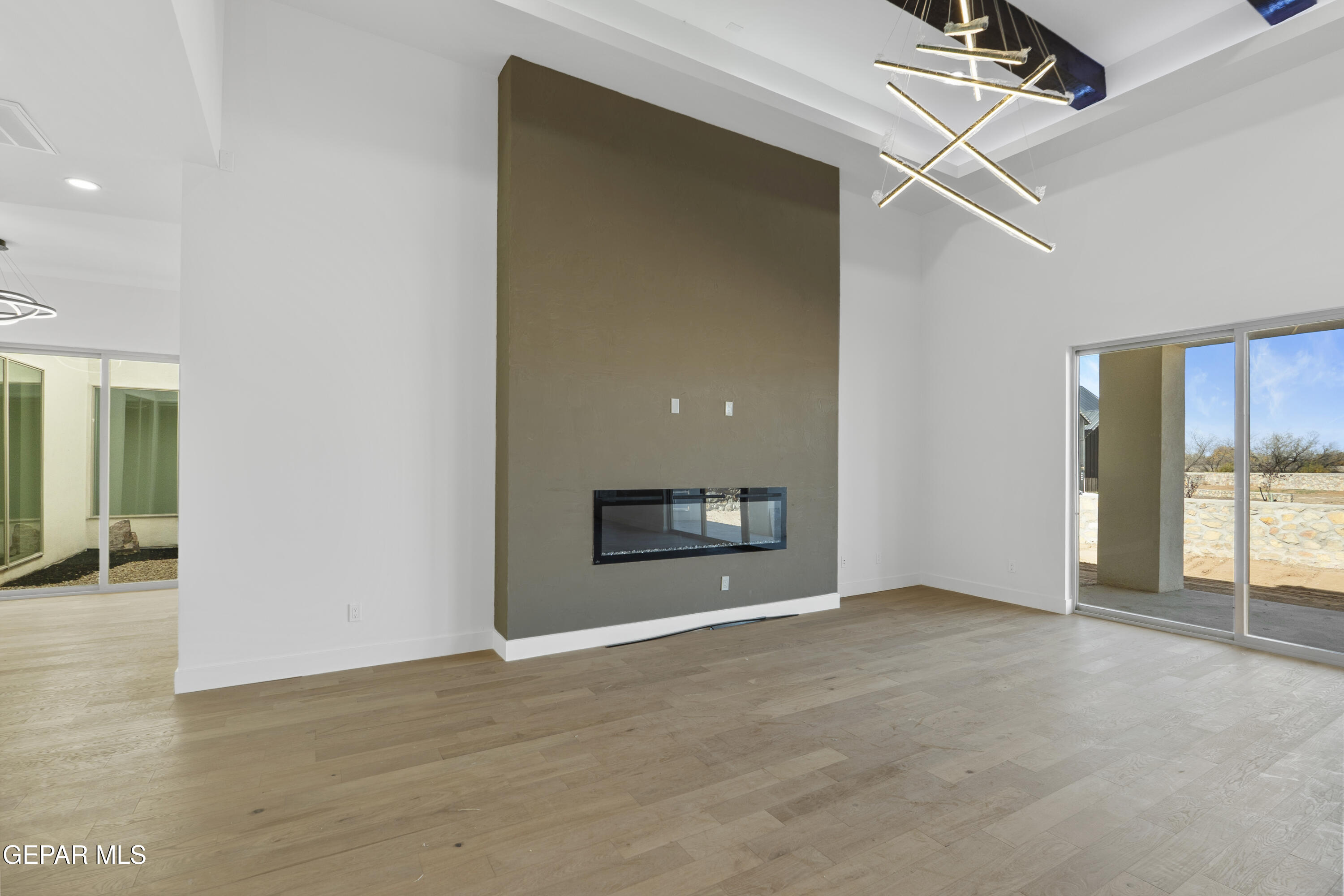 5659 Rio Bonito Circle El Paso, TX 79932 - Photo 11 of 55 an empty room with windows and fireplace