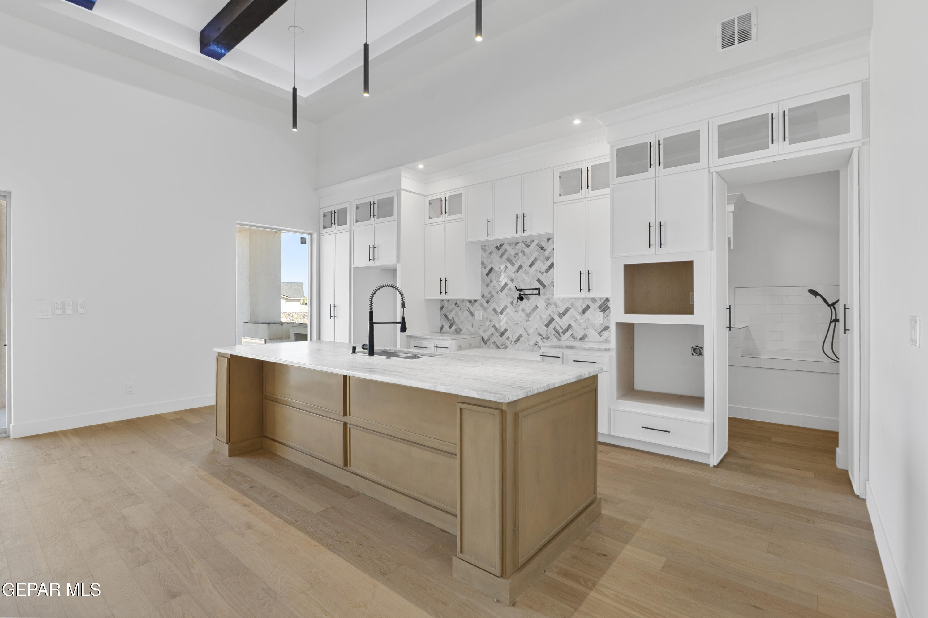 5659 Rio Bonito Circle El Paso, TX 79932 - Photo 20 of 55 a kitchen with white cabinets and sink