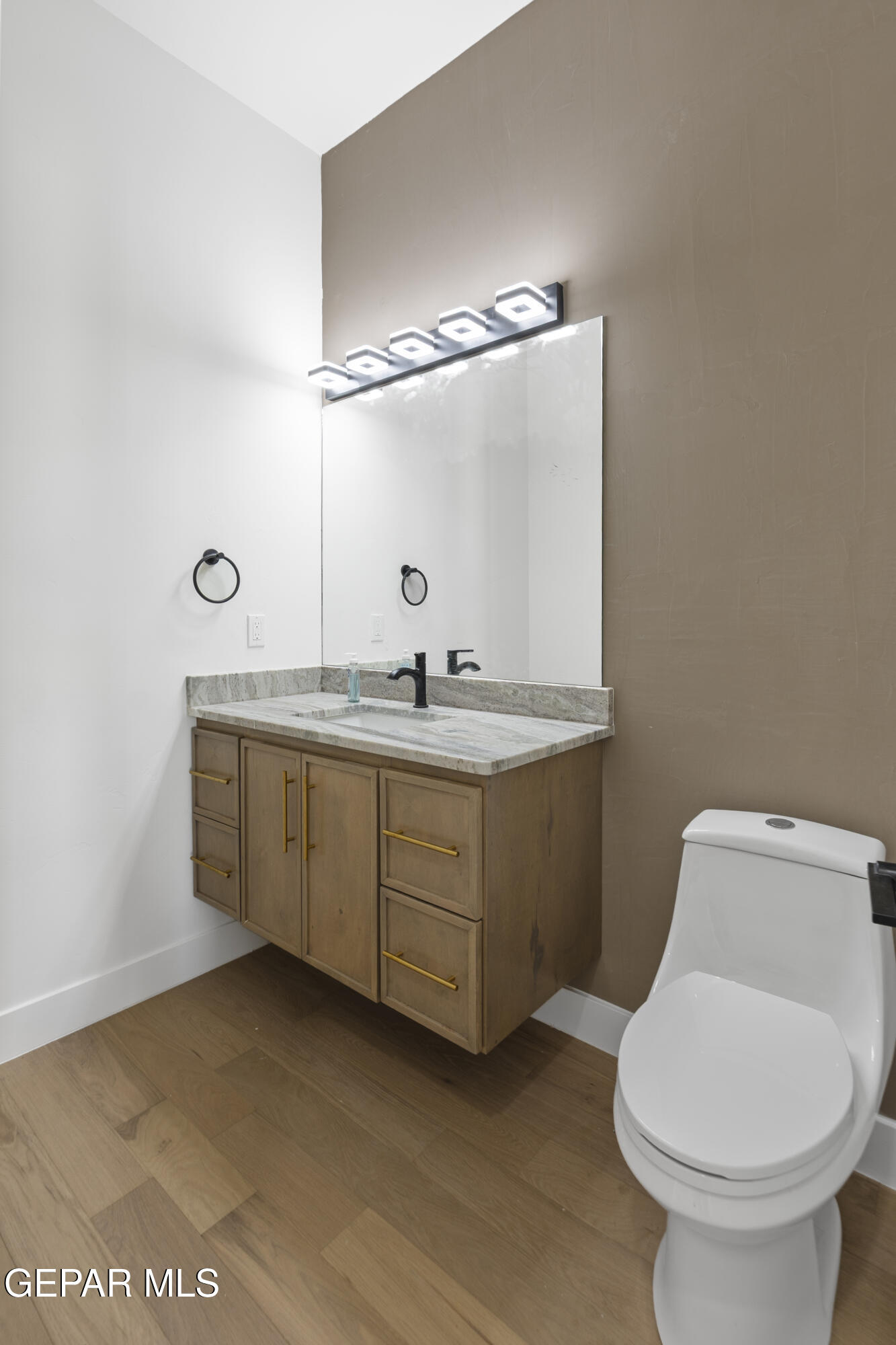 5659 Rio Bonito Circle El Paso, TX 79932 - Photo 24 of 55 a bathroom with a granite countertop toilet sink and mirror