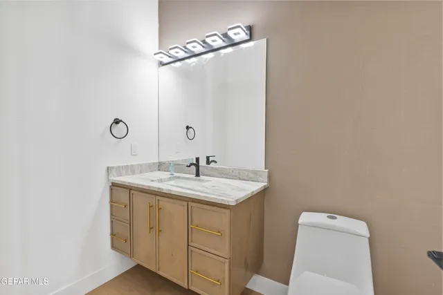 a bathroom with a double vanity sink a mirror and shower
