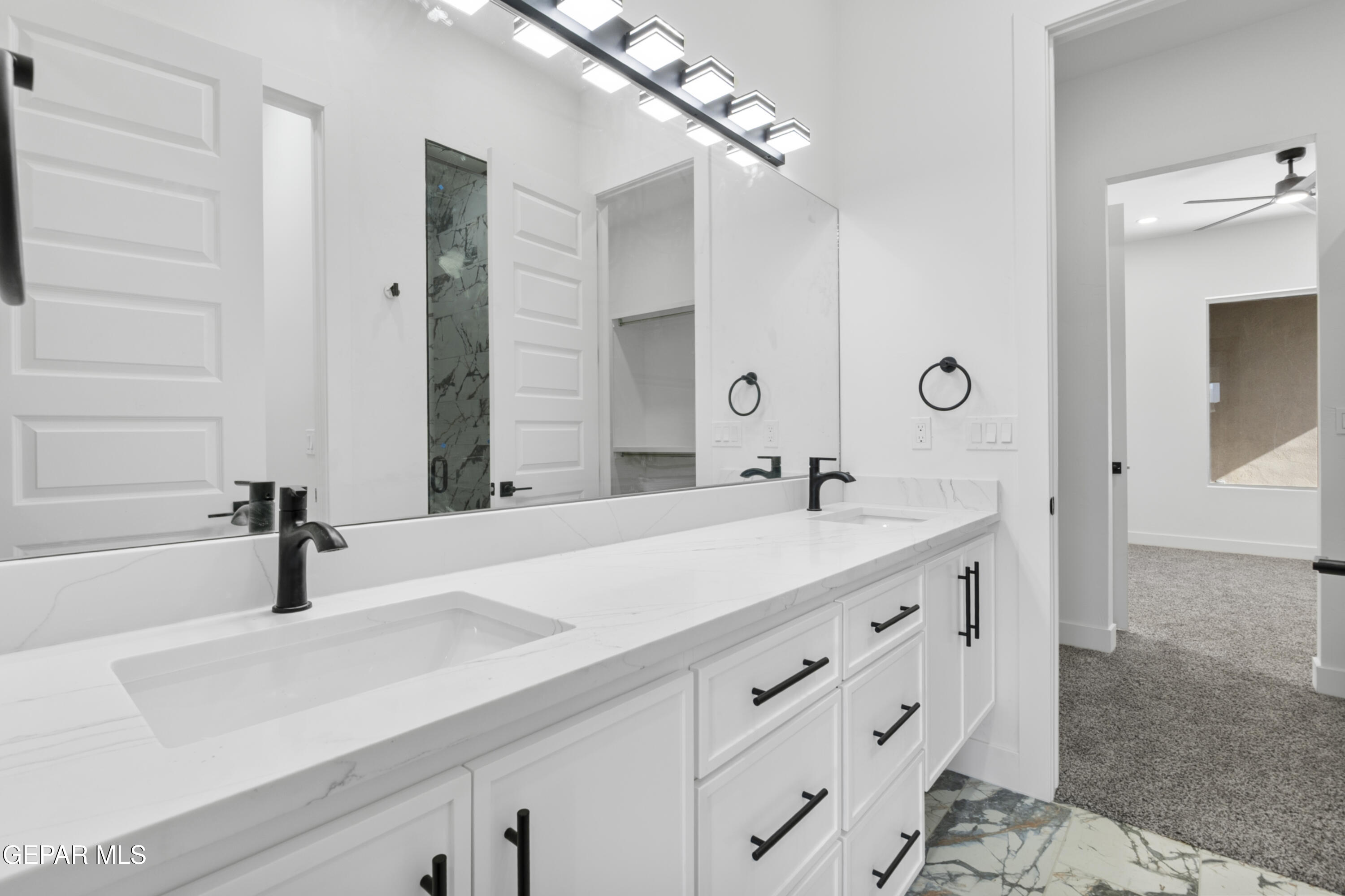 5659 Rio Bonito Circle El Paso, TX 79932 - Photo 29 of 55 a bathroom with a sink and a mirror