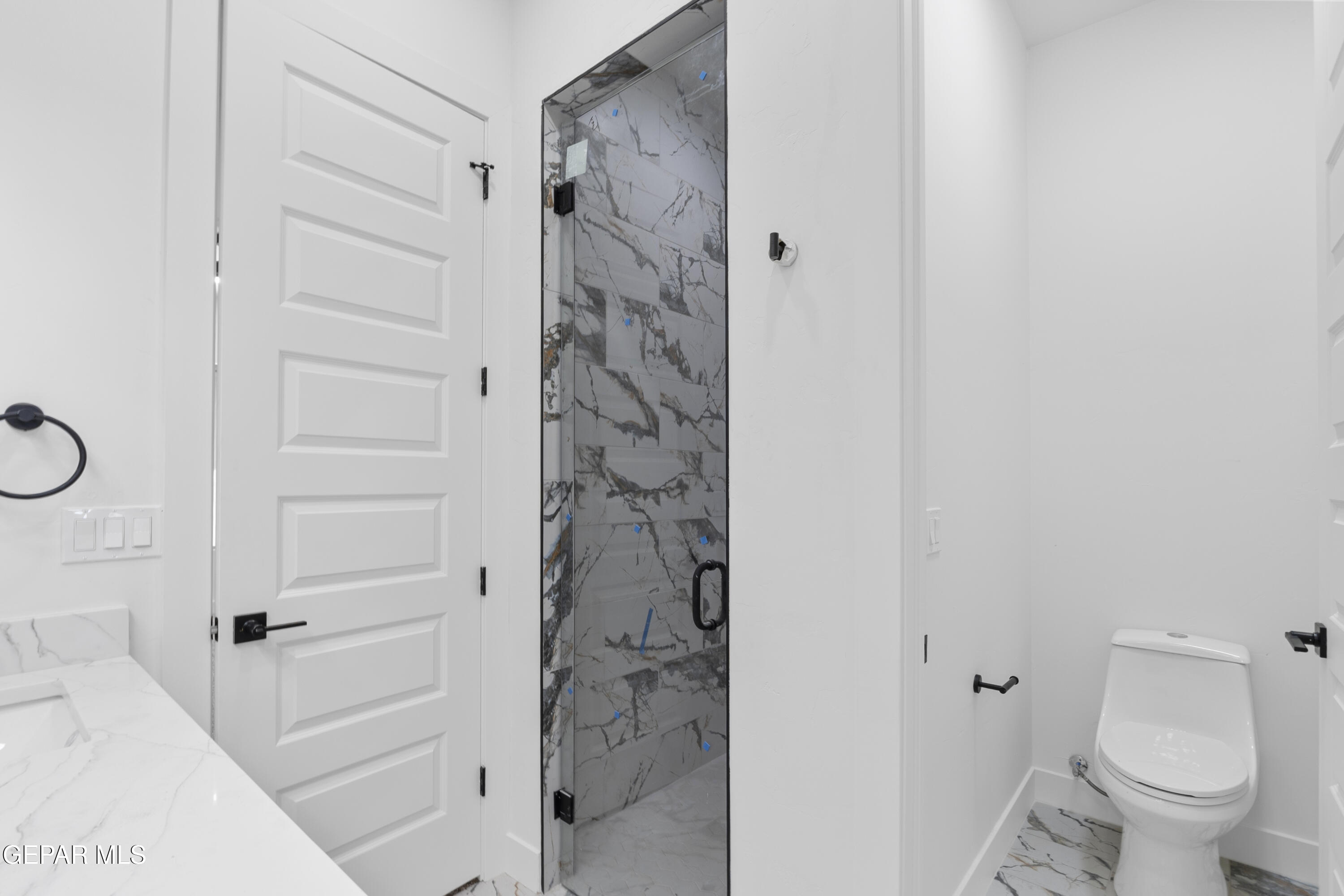 5659 Rio Bonito Circle El Paso, TX 79932 - Photo 31 of 55 a bathroom with a shower and a toilet