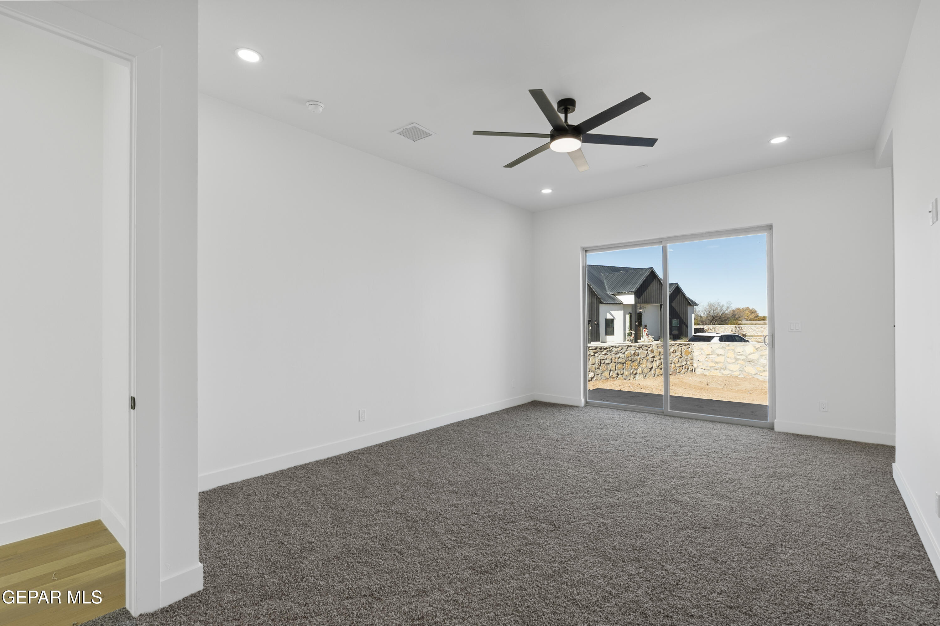 5659 Rio Bonito Circle El Paso, TX 79932 - Photo 41 of 55 a view of an empty room with a ceiling fan