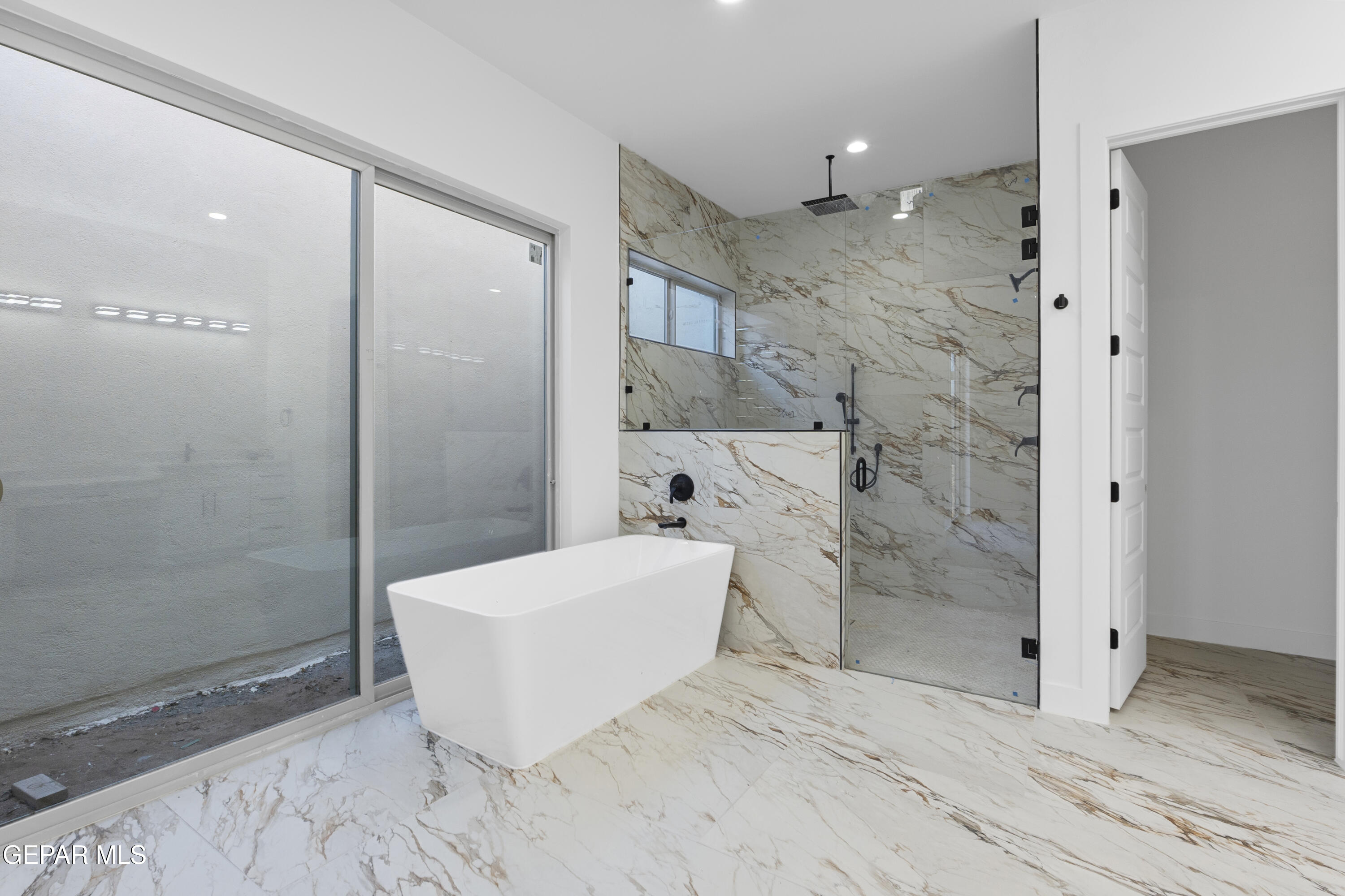 5659 Rio Bonito Circle El Paso, TX 79932 - Photo 46 of 55 a bathroom with a bathtub and shower