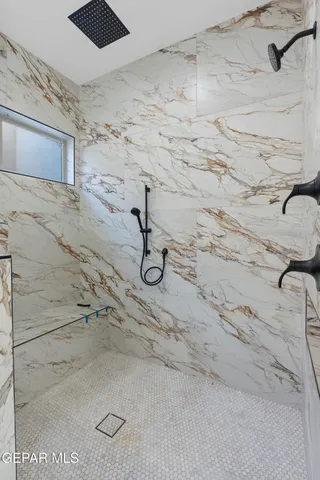 a view of a big room with wooden floor and windows