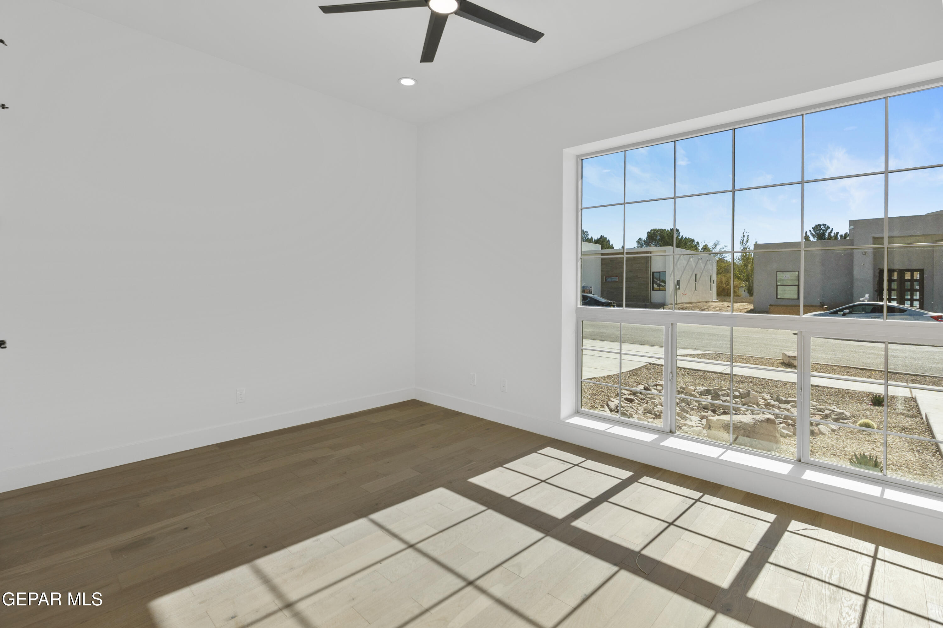 5659 Rio Bonito Circle El Paso, TX 79932 - Photo 8 of 55 a view of a livingroom with wooden floor and a flat screen tv