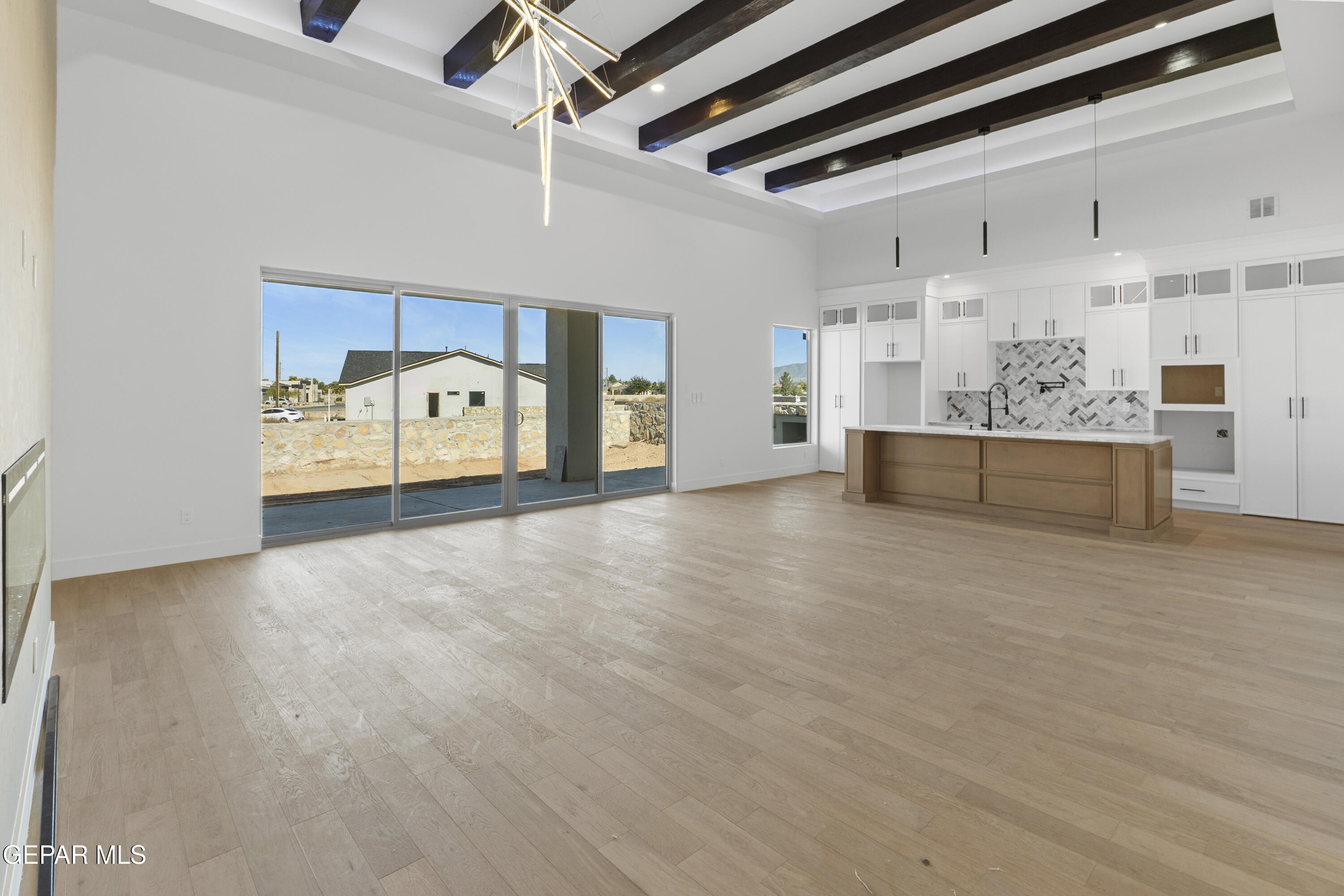 5659 Rio Bonito Circle El Paso, TX 79932 - Photo 10 of 55 a view of an empty room with kitchen