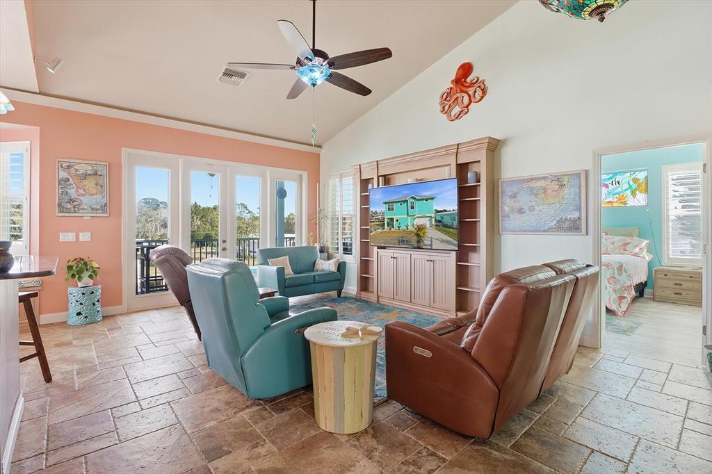 2571 North Seneca Point Crystal River, FL 34429 - Photo 11 of 58 a living room with furniture and a floor to ceiling window