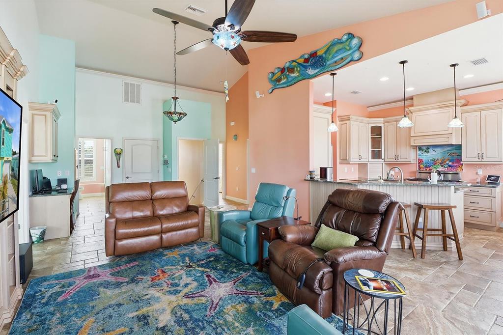 2571 North Seneca Point Crystal River, FL 34429 - Photo 14 of 58 a living room with furniture fireplace and a chandelier