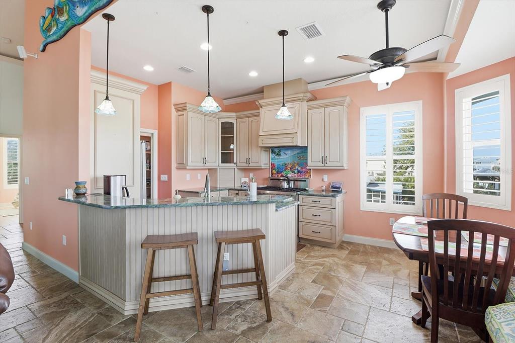 2571 North Seneca Point Crystal River, FL 34429 - Photo 16 of 58 a large kitchen with a table and chairs