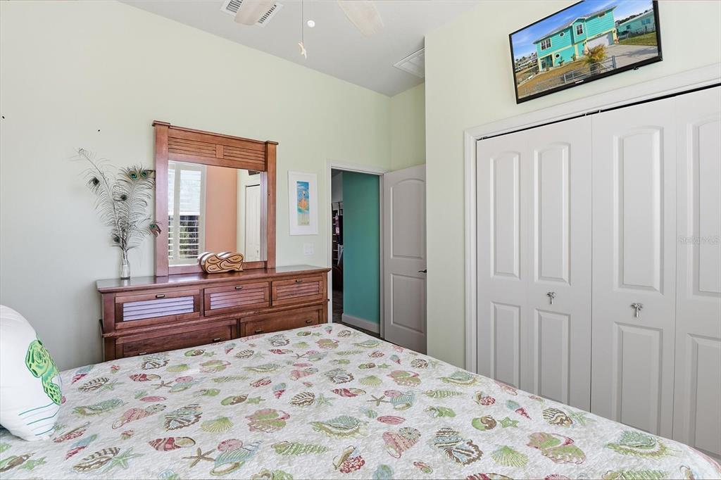 2571 North Seneca Point Crystal River, FL 34429 - Photo 22 of 58 a bedroom with a bed and a dresser in it