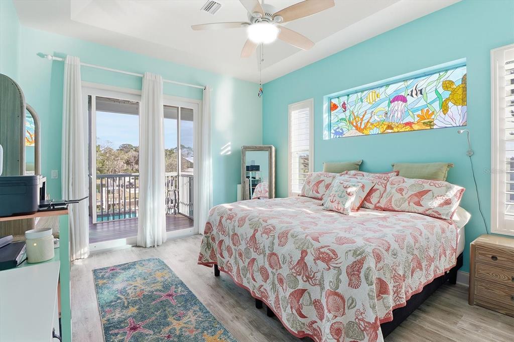 2571 North Seneca Point Crystal River, FL 34429 - Photo 26 of 58 a bedroom with a bed painting on wall and a large window