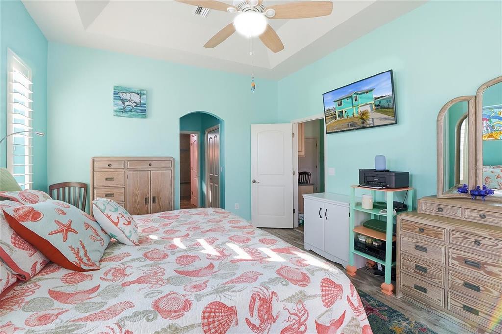 2571 North Seneca Point Crystal River, FL 34429 - Photo 27 of 58 a bedroom with a bed and a dresser in it