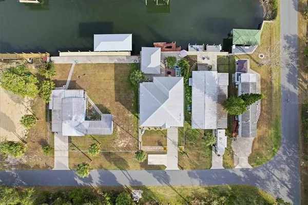 a backyard of a house with lots of green space and wooden floors