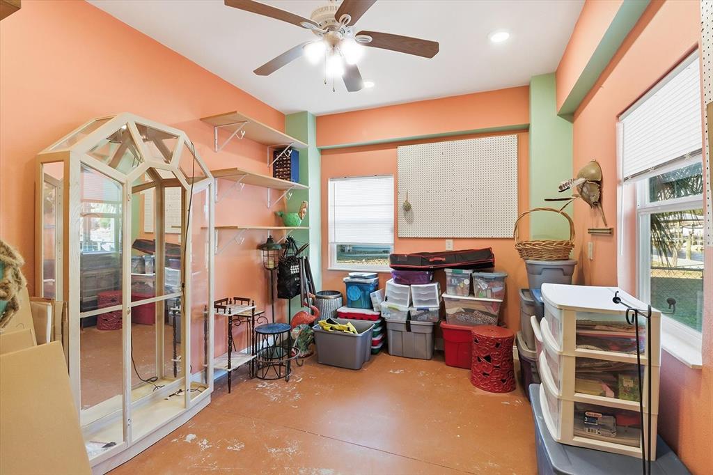 2571 North Seneca Point Crystal River, FL 34429 - Photo 5 of 58 a room with furniture a large window and a chandelier