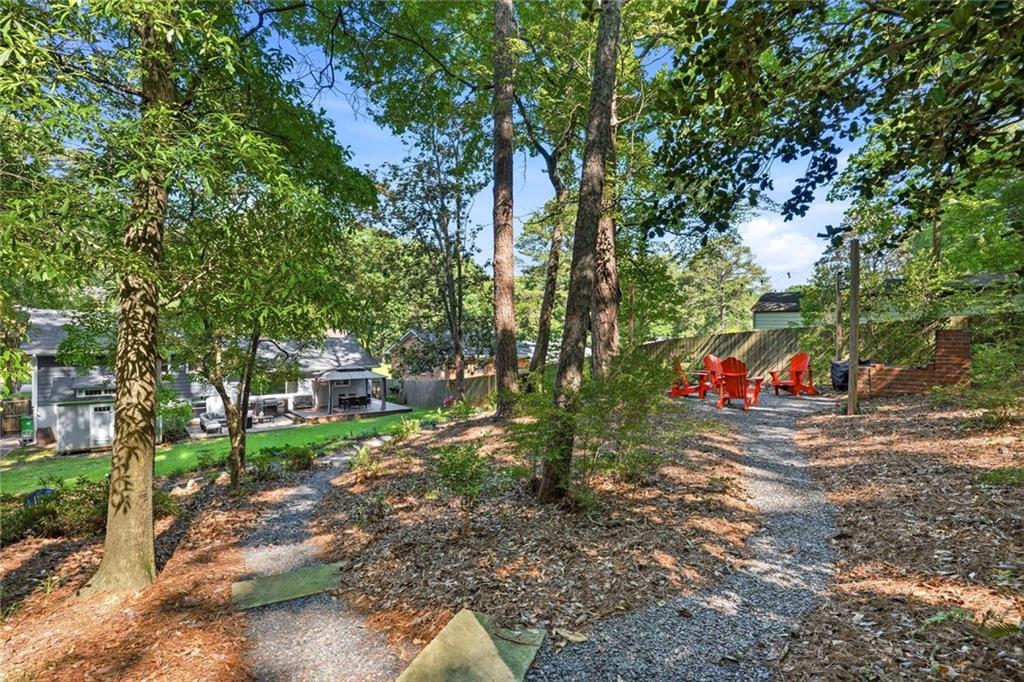 1430 Thomas Road Decatur, GA 30030 - Photo 37 of 42 a backyard of a house with table and chairs