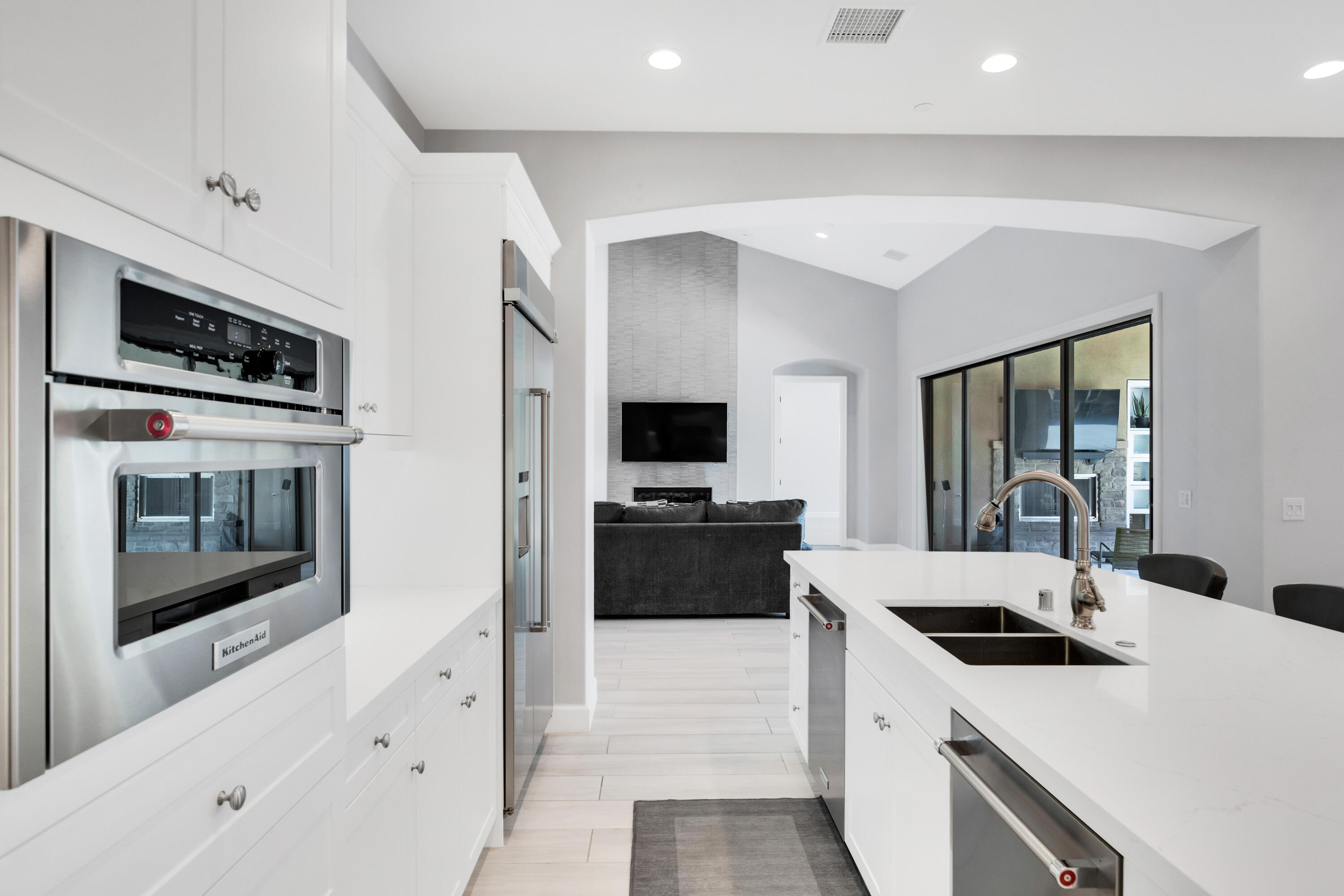 81925 Four Seasons Place La Quinta, CA 92253 - Photo 11 of 27 a large white kitchen with a stove and a refrigerator