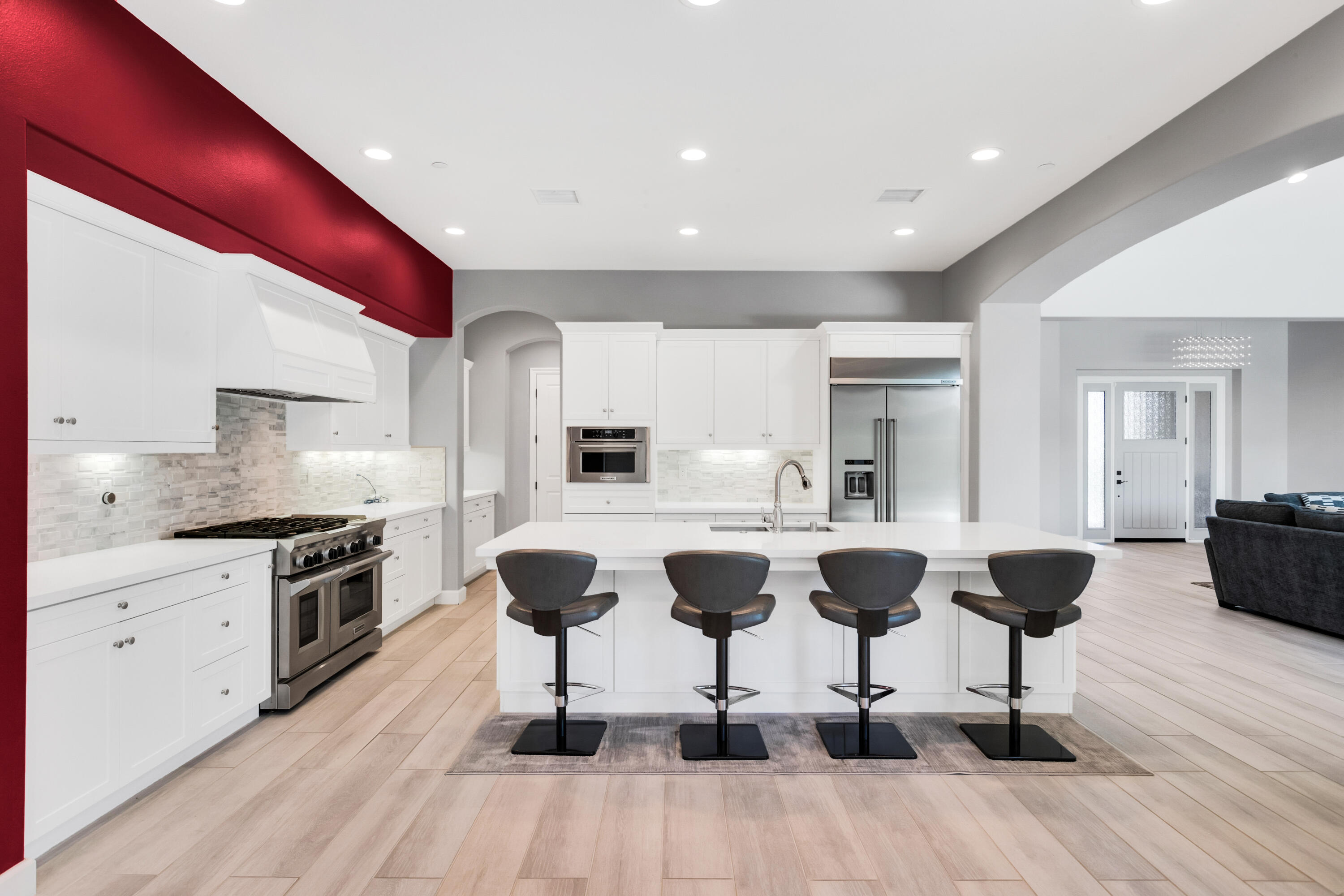 81925 Four Seasons Place La Quinta, CA 92253 - Photo 12 of 27 a kitchen with granite countertop kitchen island stainless steel appliances a stove a sink a counter top space and cabinets
