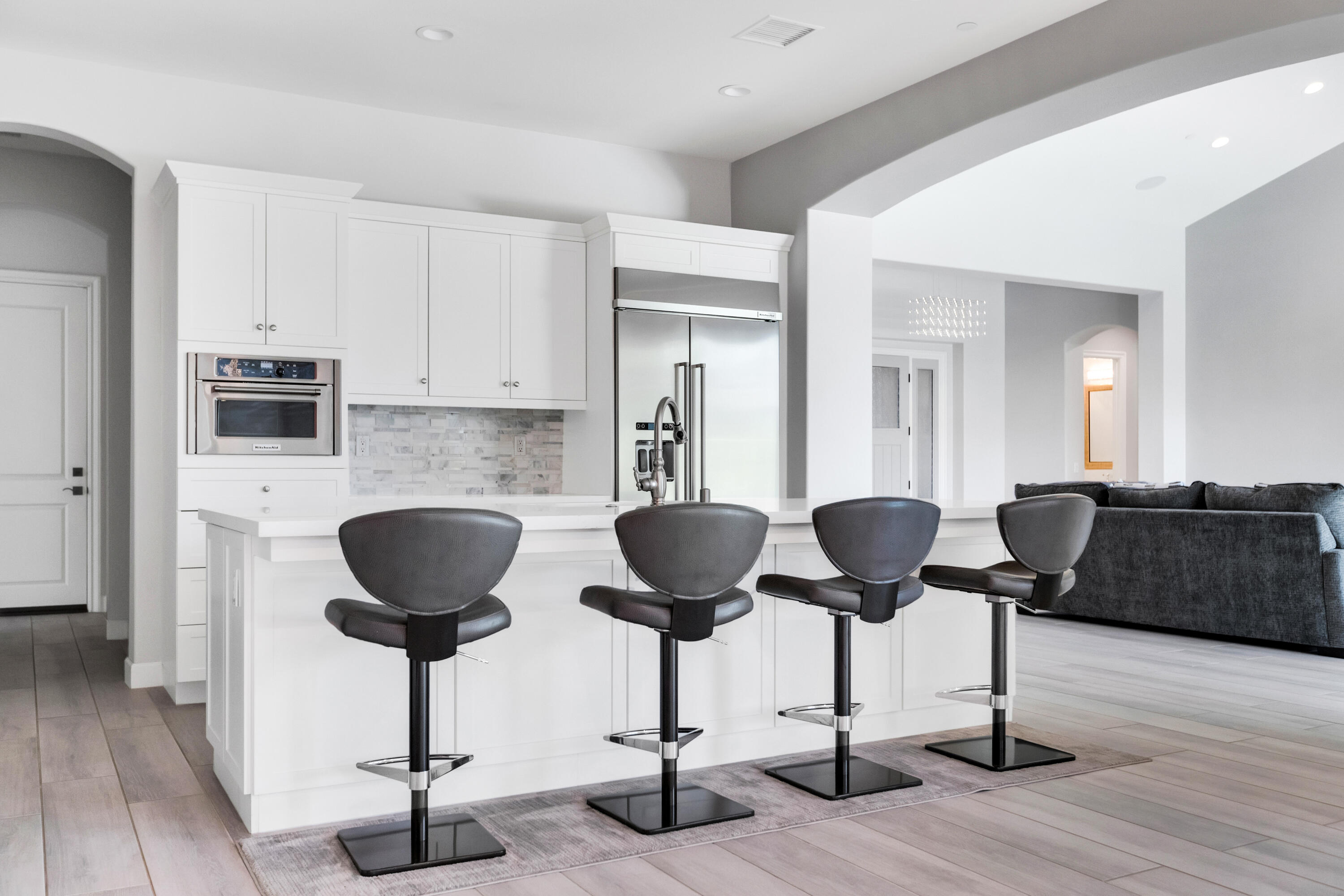 81925 Four Seasons Place La Quinta, CA 92253 - Photo 13 of 27 a kitchen with granite countertop a counter space a sink and a a fireplace