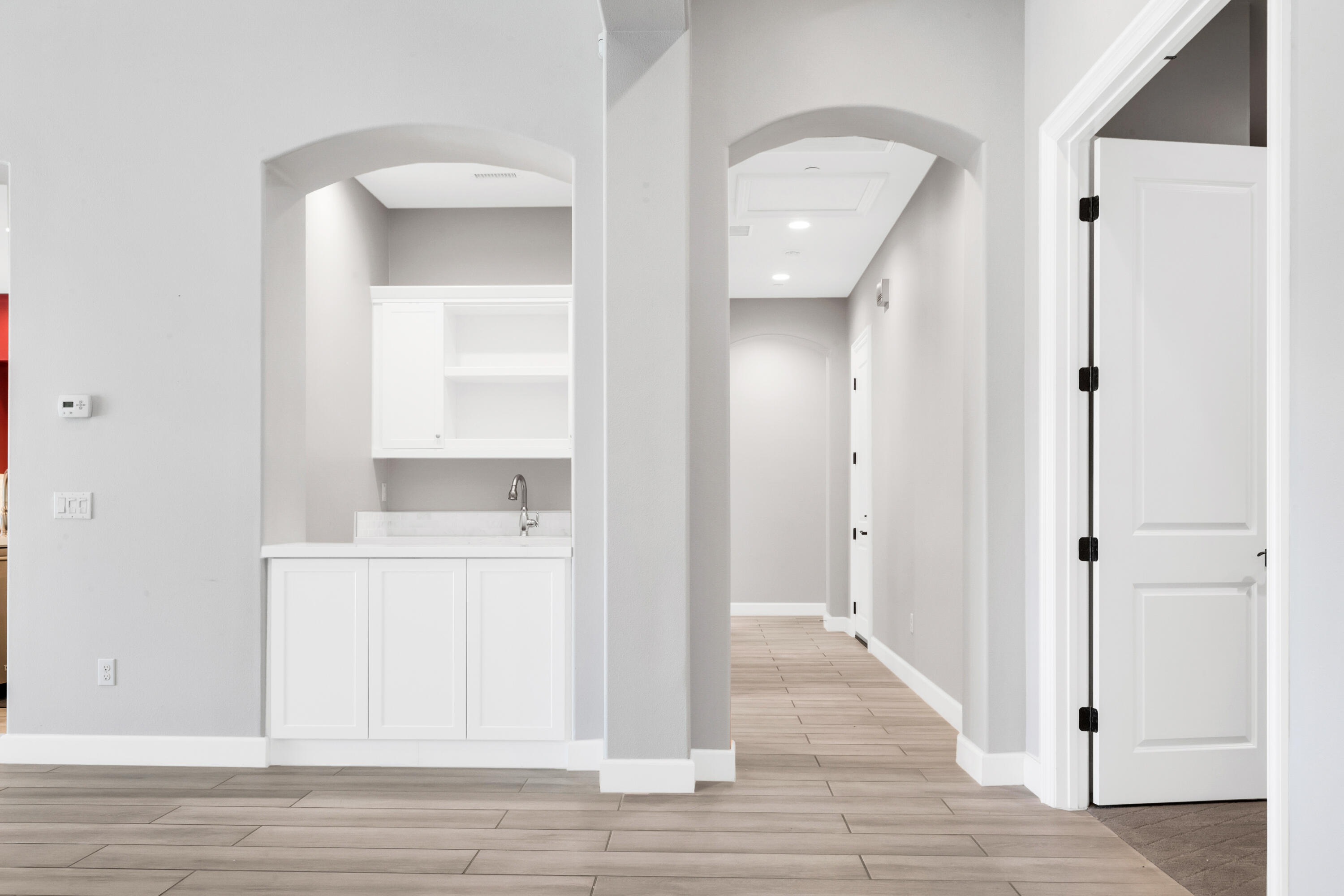 81925 Four Seasons Place La Quinta, CA 92253 - Photo 16 of 27 a view of a hallway with wooden floor