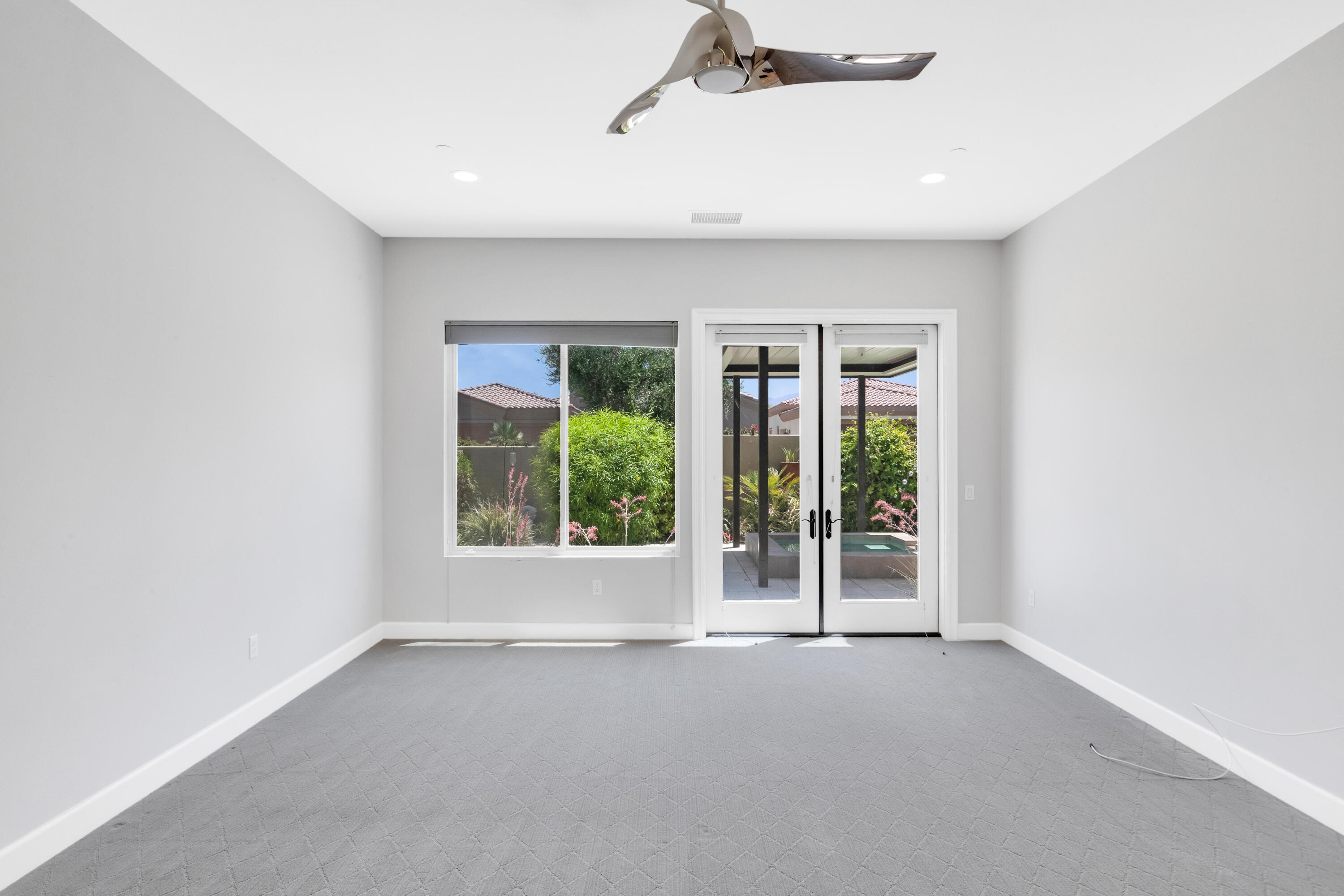 81925 Four Seasons Place La Quinta, CA 92253 - Photo 18 of 27 an empty room with windows and view