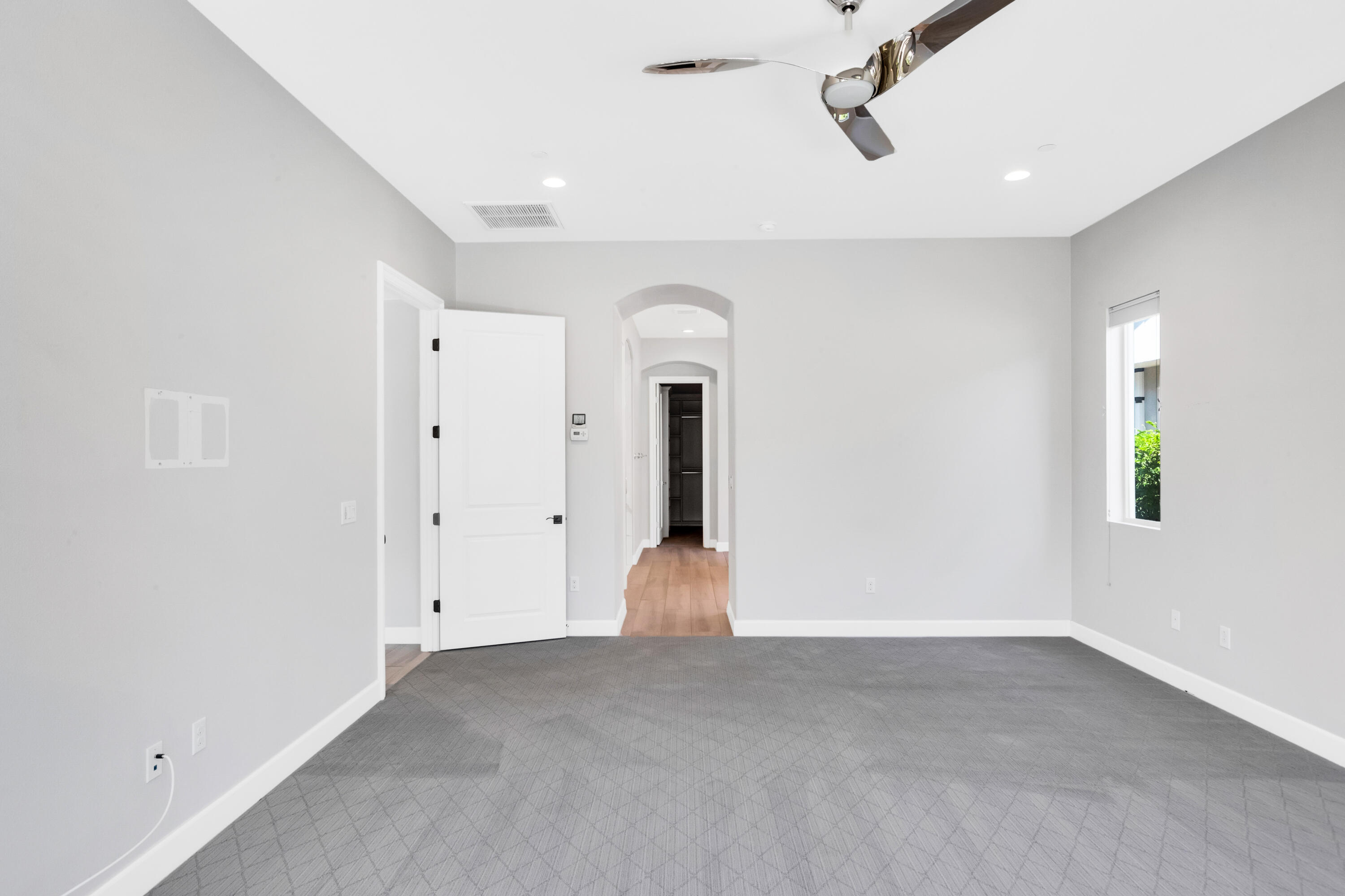 81925 Four Seasons Place La Quinta, CA 92253 - Photo 19 of 27 wooden floor in an empty room with a window