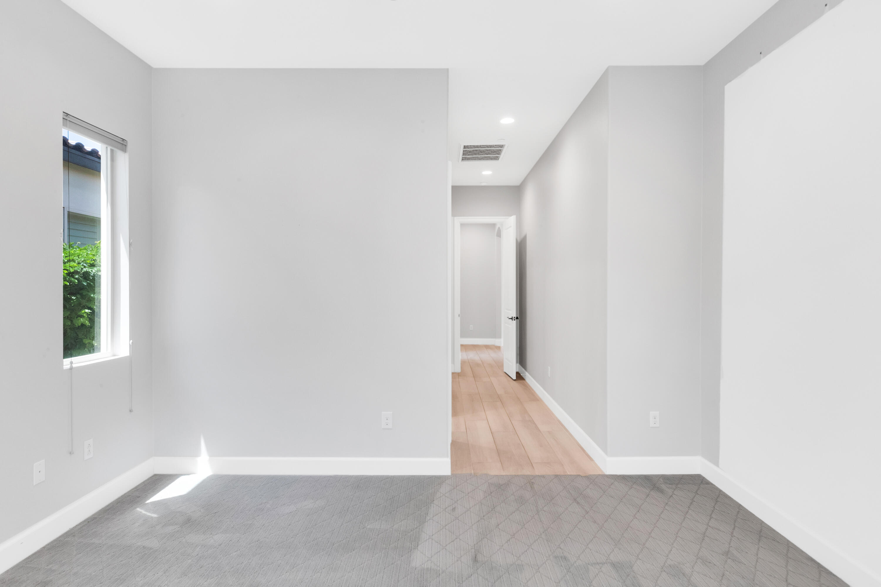 81925 Four Seasons Place La Quinta, CA 92253 - Photo 25 of 27 a view of an empty room with wooden floor and a window