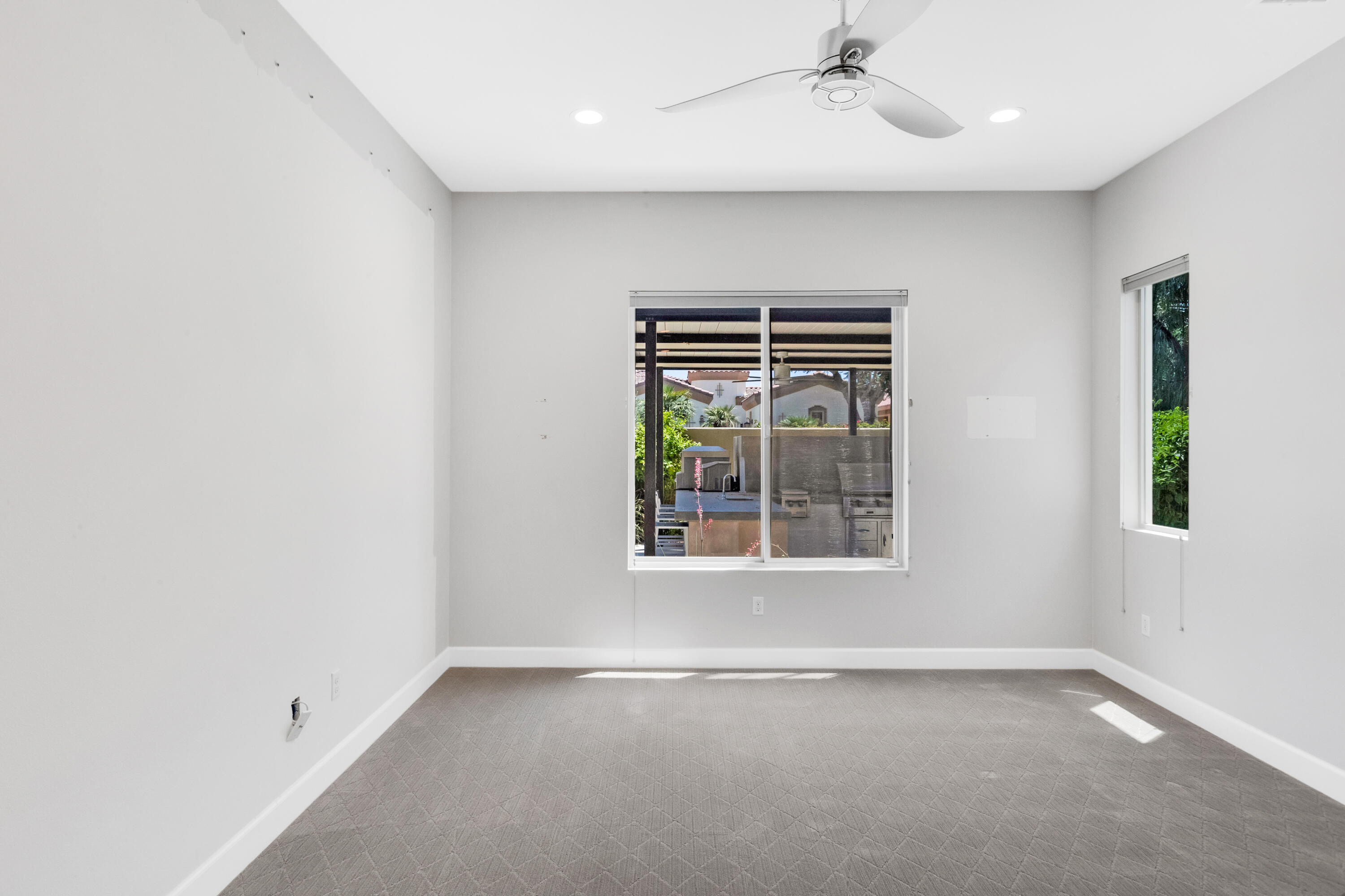 81925 Four Seasons Place La Quinta, CA 92253 - Photo 26 of 27 an empty room with windows and closet