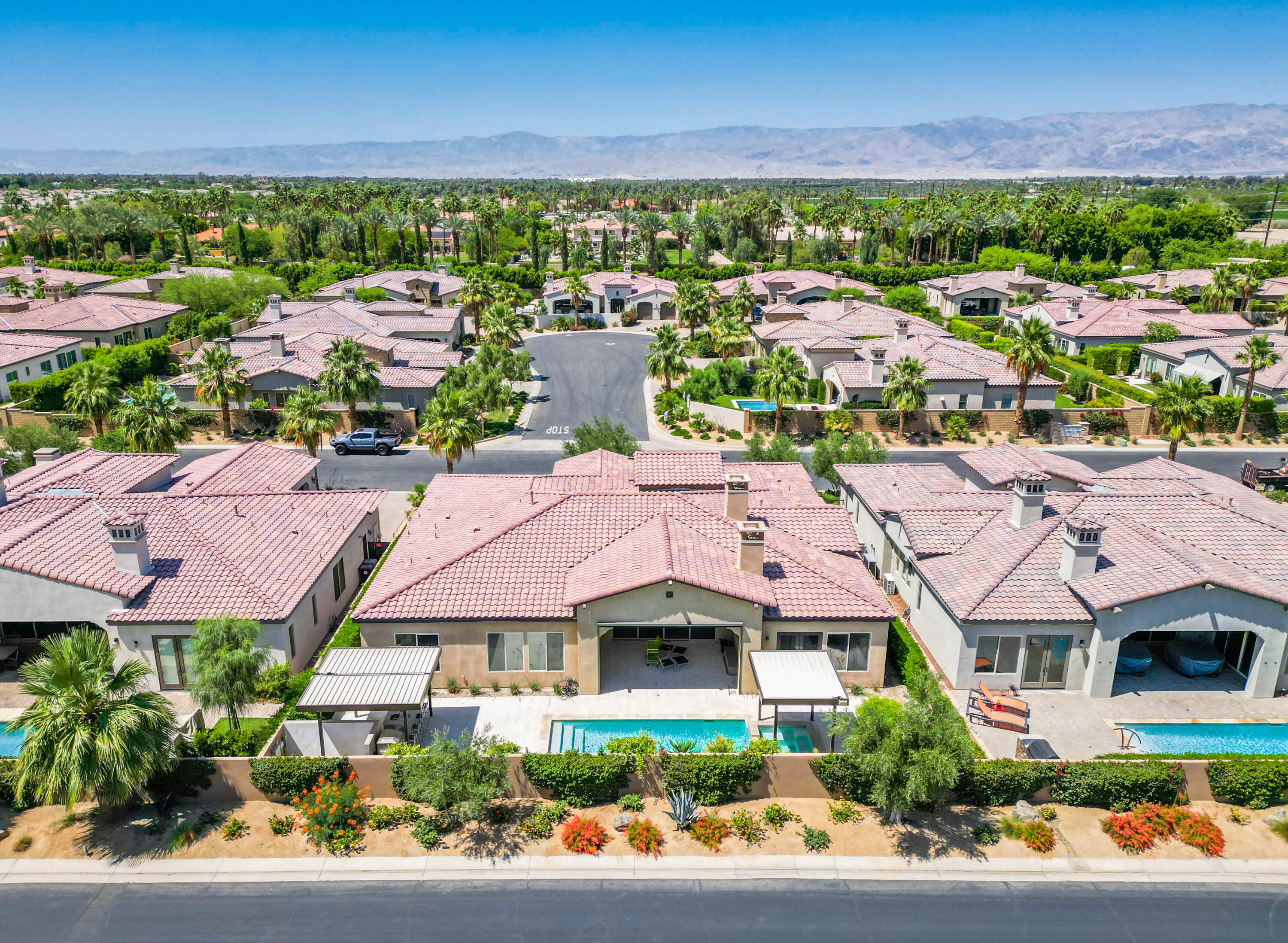 81925 Four Seasons Place La Quinta, CA 92253 - Photo 3 of 27 an aerial view of residential houses with outdoor space and street view