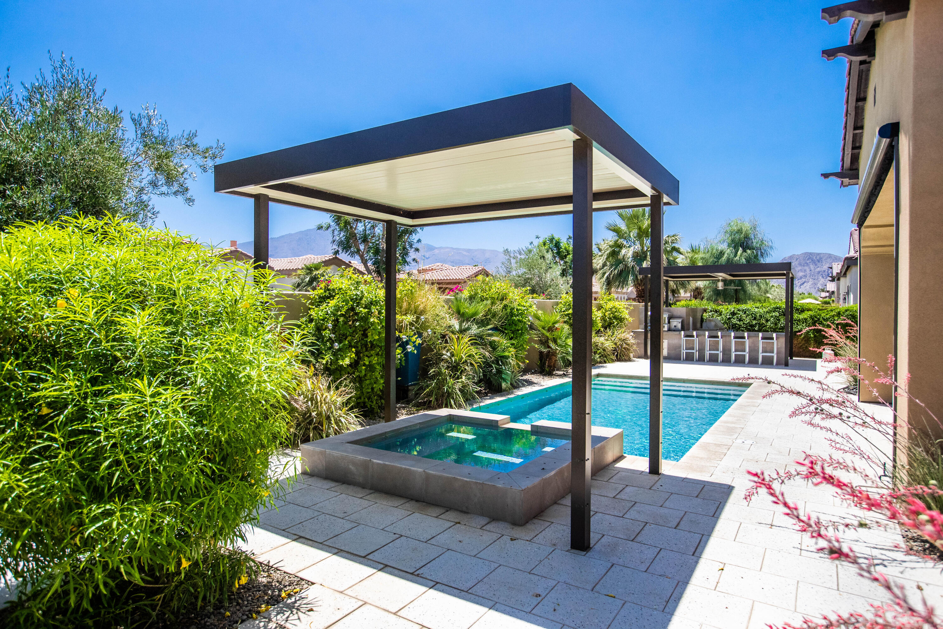 81925 Four Seasons Place La Quinta, CA 92253 - Photo 5 of 27 a view of a couches in the patio with a small yard