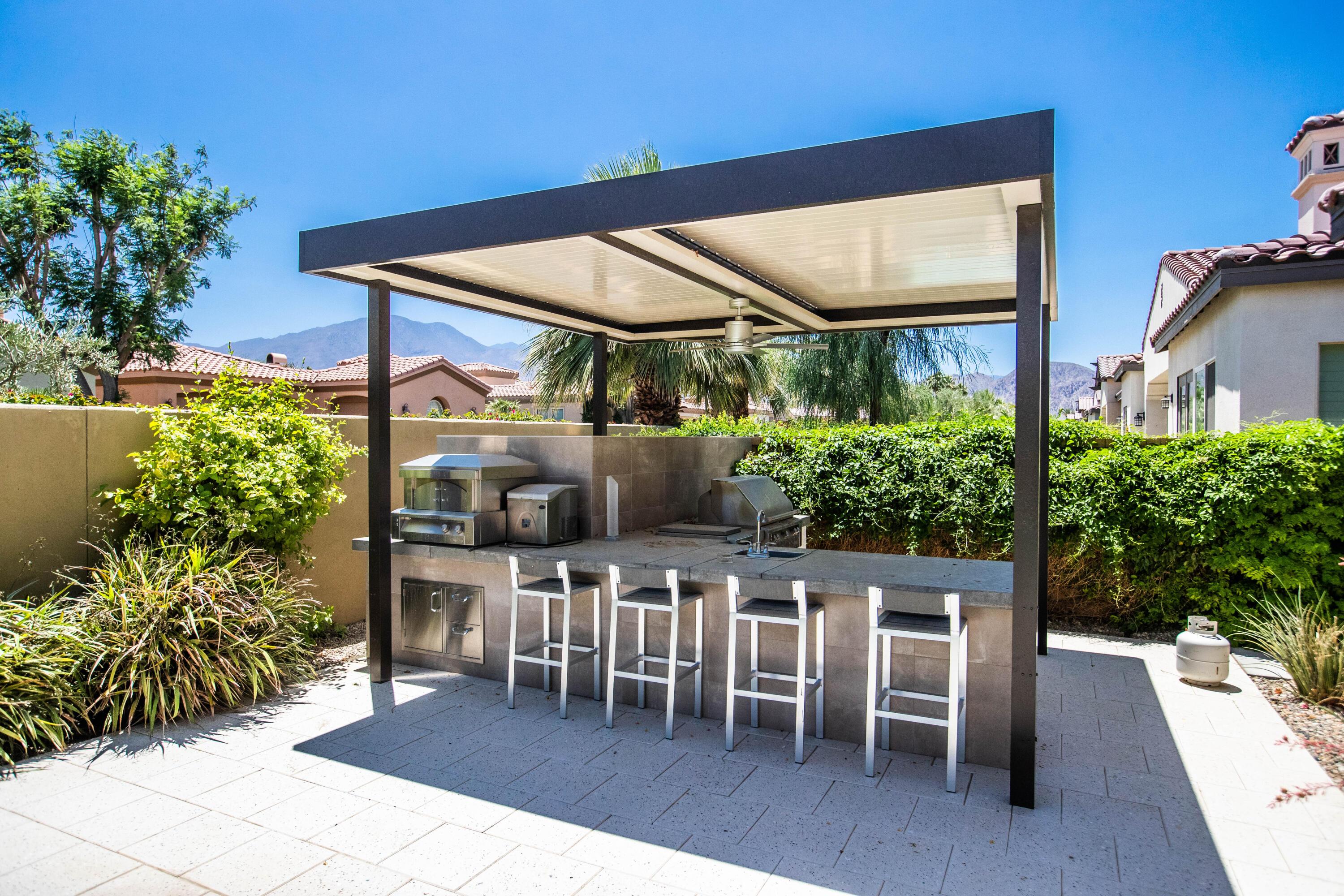 81925 Four Seasons Place La Quinta, CA 92253 - Photo 6 of 27 a view of dining room and chairs and table in a patio
