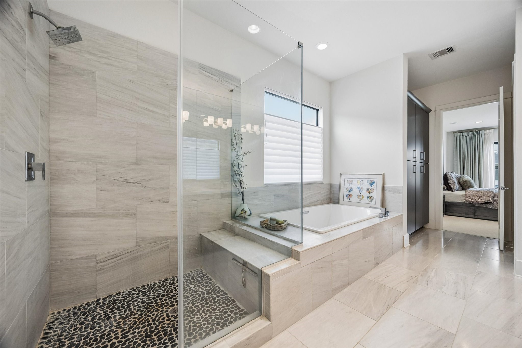 1526 Vermont Street Houston, TX 77006 - Photo 31 of 39 Large walk-in shower and soaking tub create a luxurious primary bath experience.