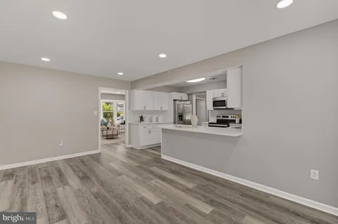 a view of kitchen with wooden floor