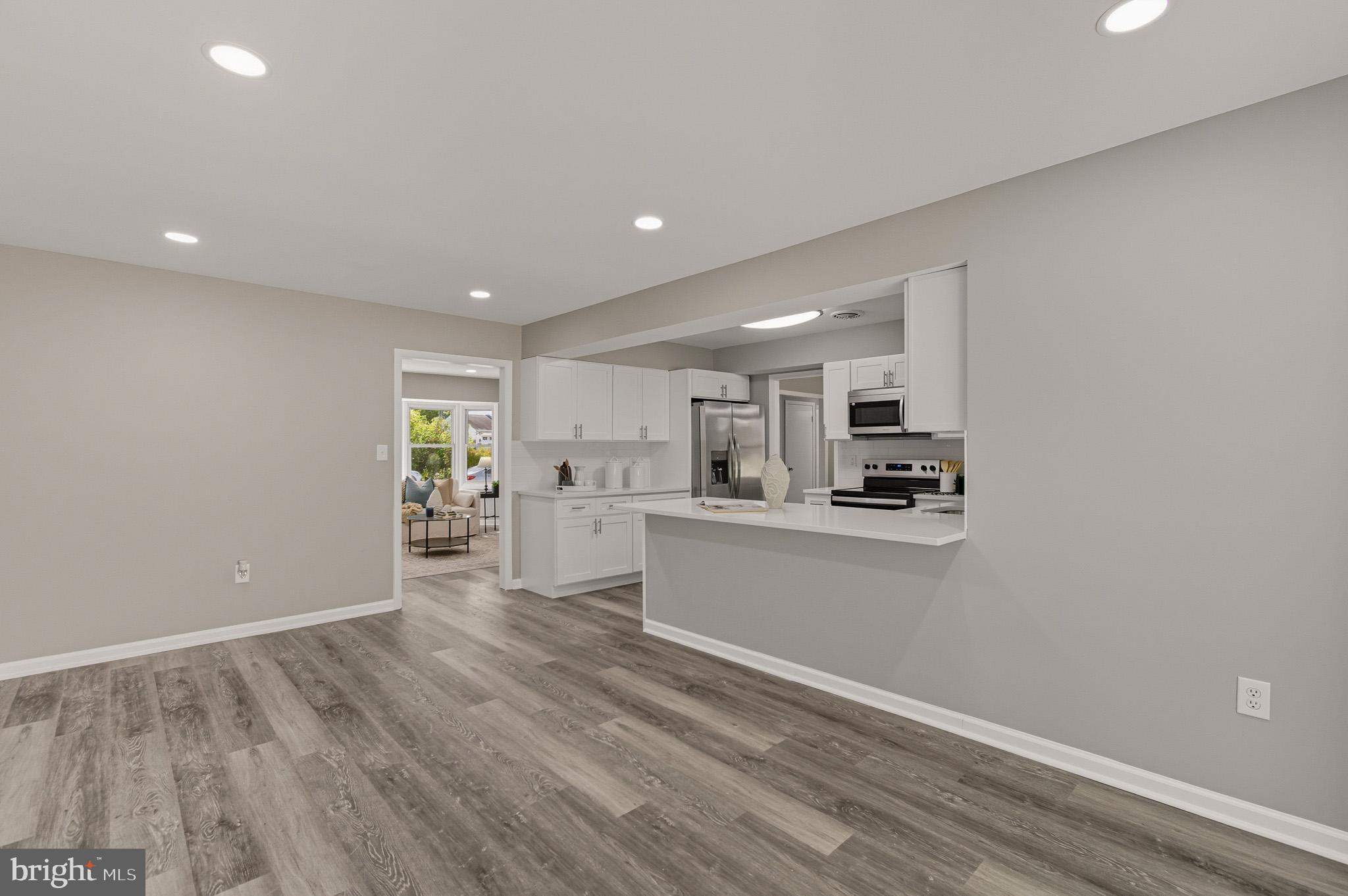 12414 Sandal Lane Bowie, MD 20715 - Photo 14 of 46 a view of kitchen with wooden floor