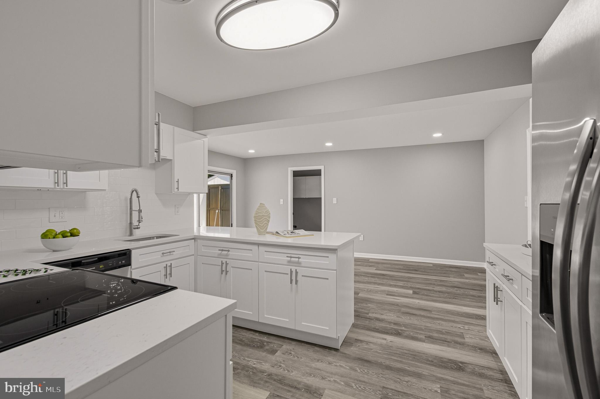 12414 Sandal Lane Bowie, MD 20715 - Photo 17 of 46 a kitchen with a sink stainless steel appliances and cabinets