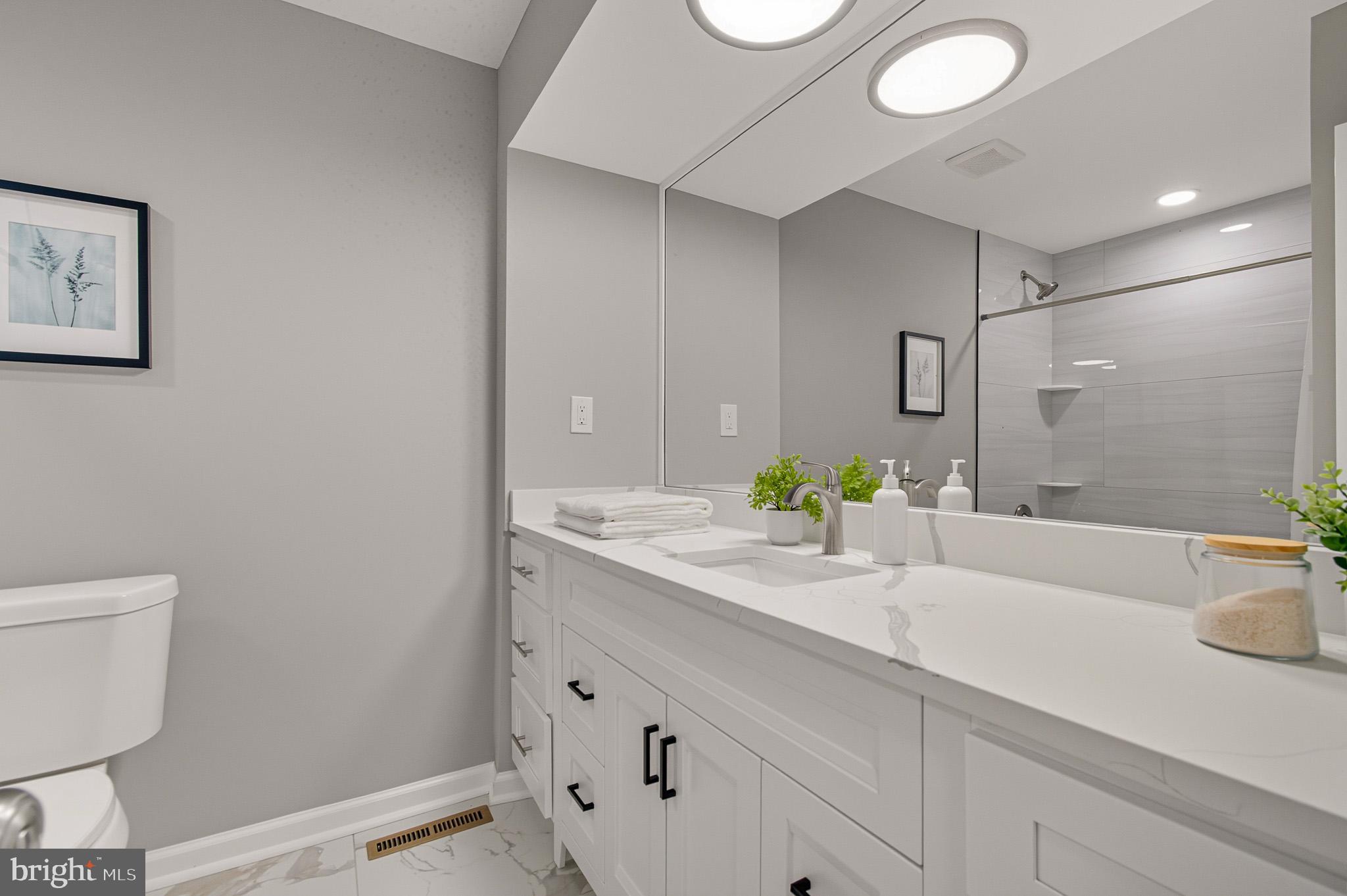 12414 Sandal Lane Bowie, MD 20715 - Photo 23 of 46 a bathroom with a sink and a mirror