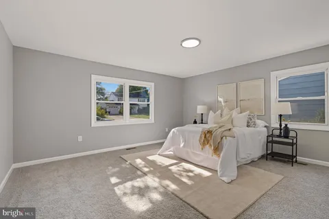 a bedroom with bed and window