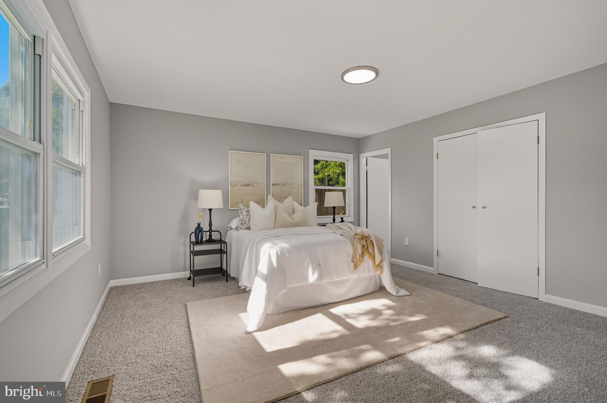 12414 Sandal Lane Bowie, MD 20715 - Photo 25 of 46 a spacious bedroom with a bed and window