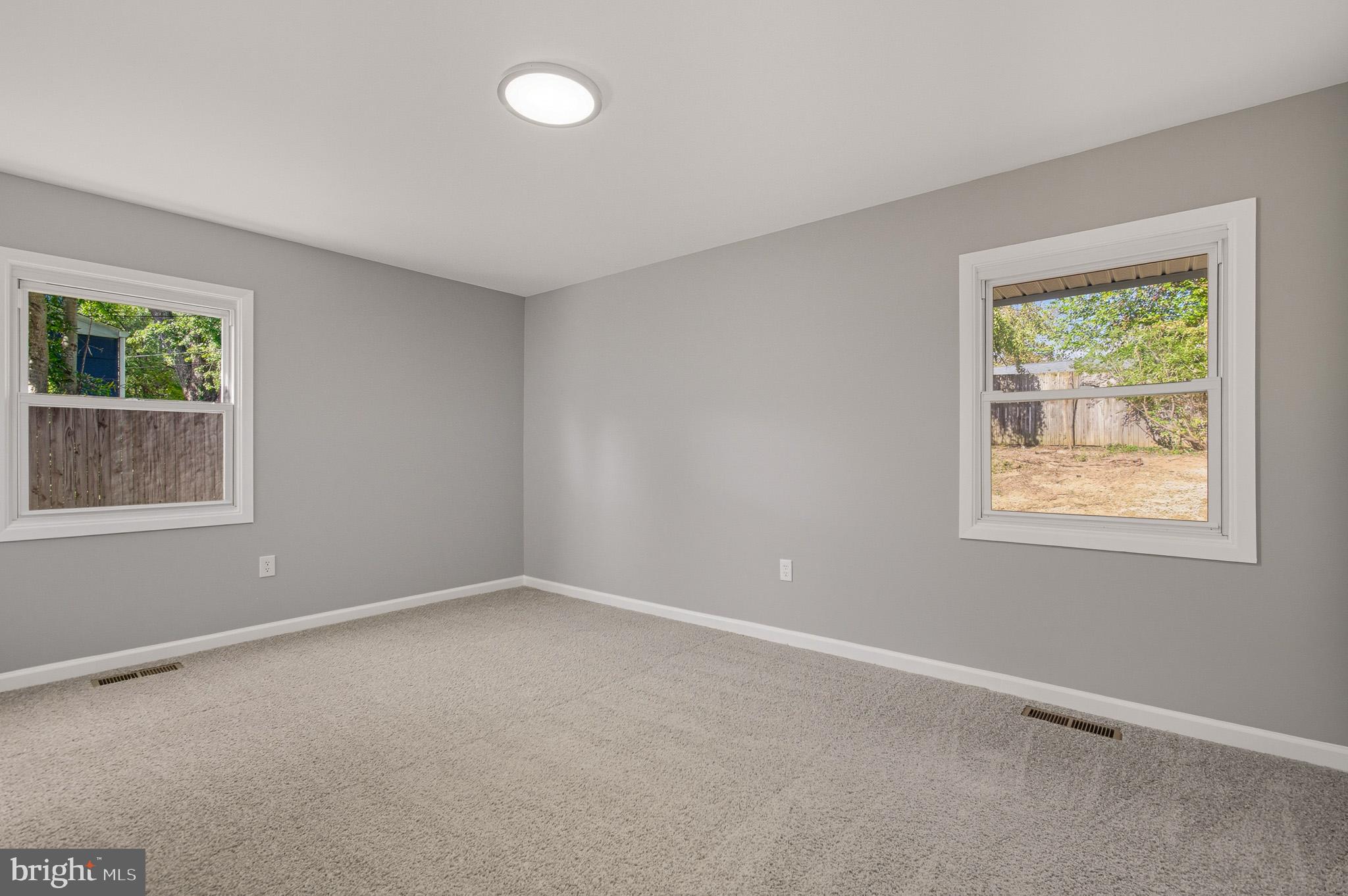 12414 Sandal Lane Bowie, MD 20715 - Photo 29 of 46 an empty room with windows