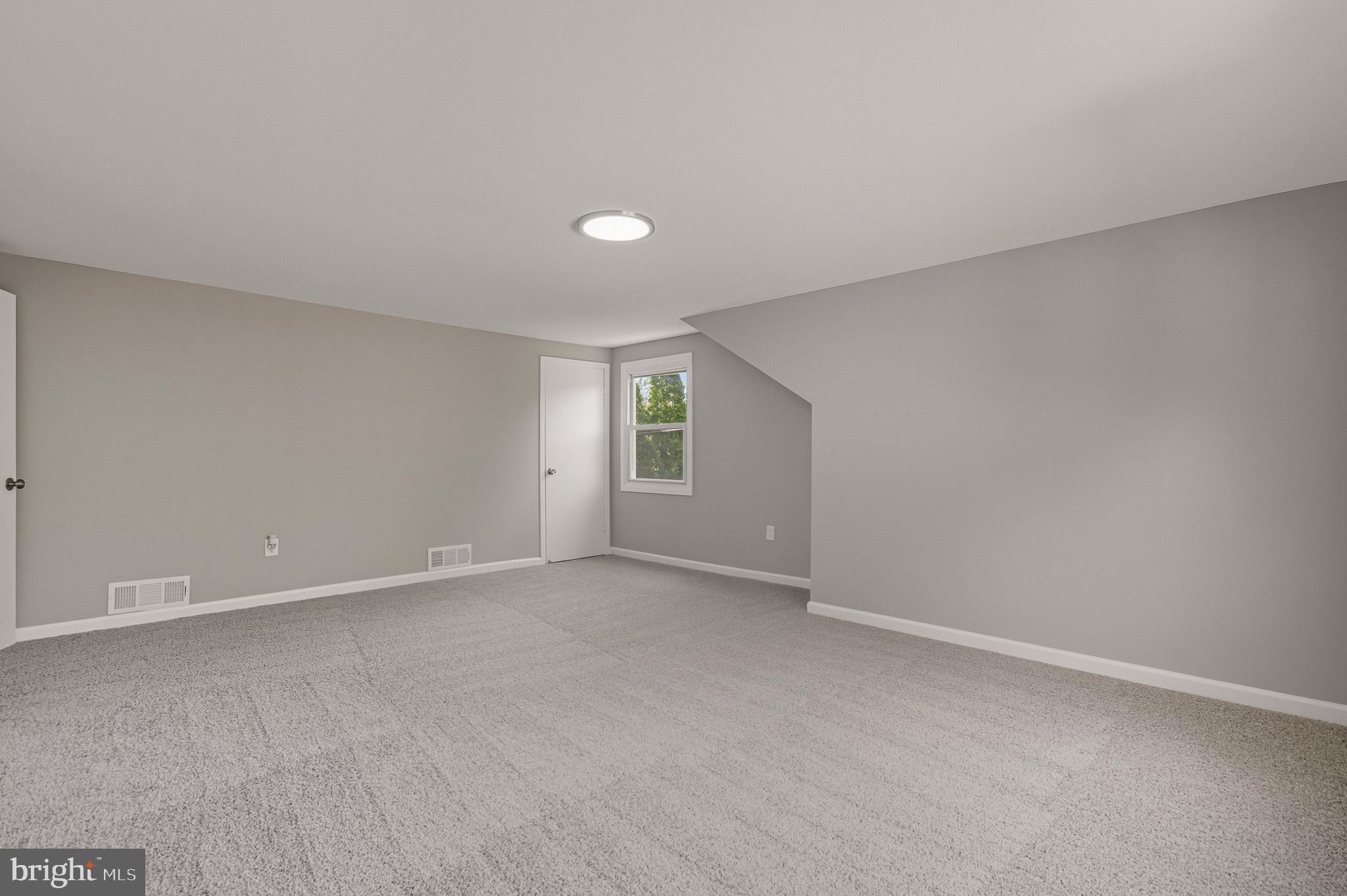 12414 Sandal Lane Bowie, MD 20715 - Photo 31 of 46 a view of an empty room with a window