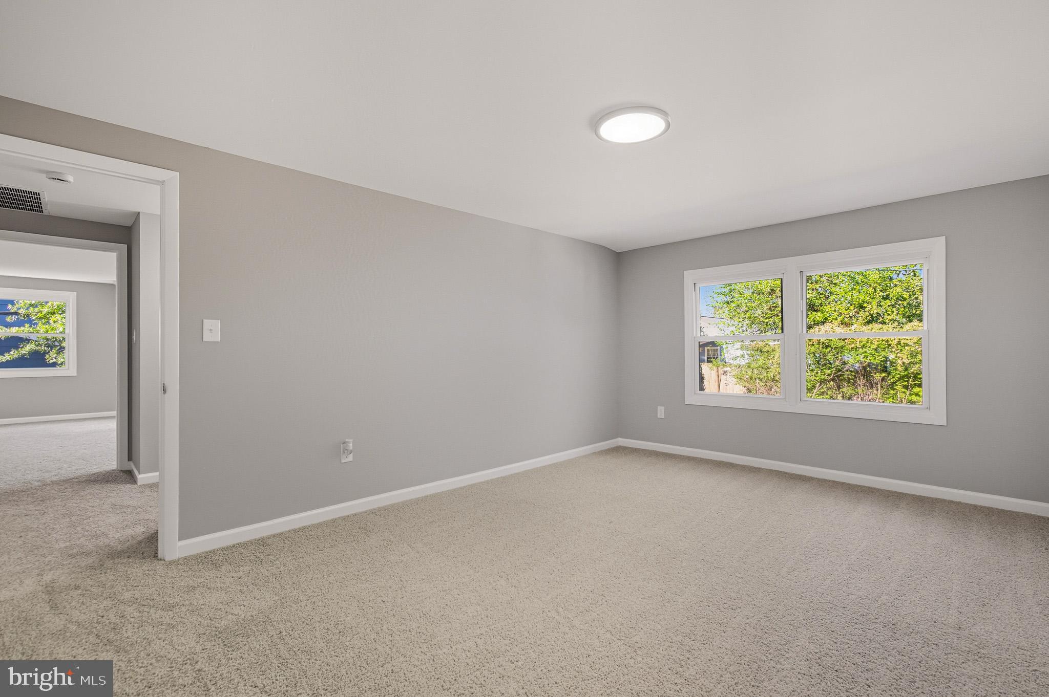 12414 Sandal Lane Bowie, MD 20715 - Photo 36 of 46 an empty room with windows and view
