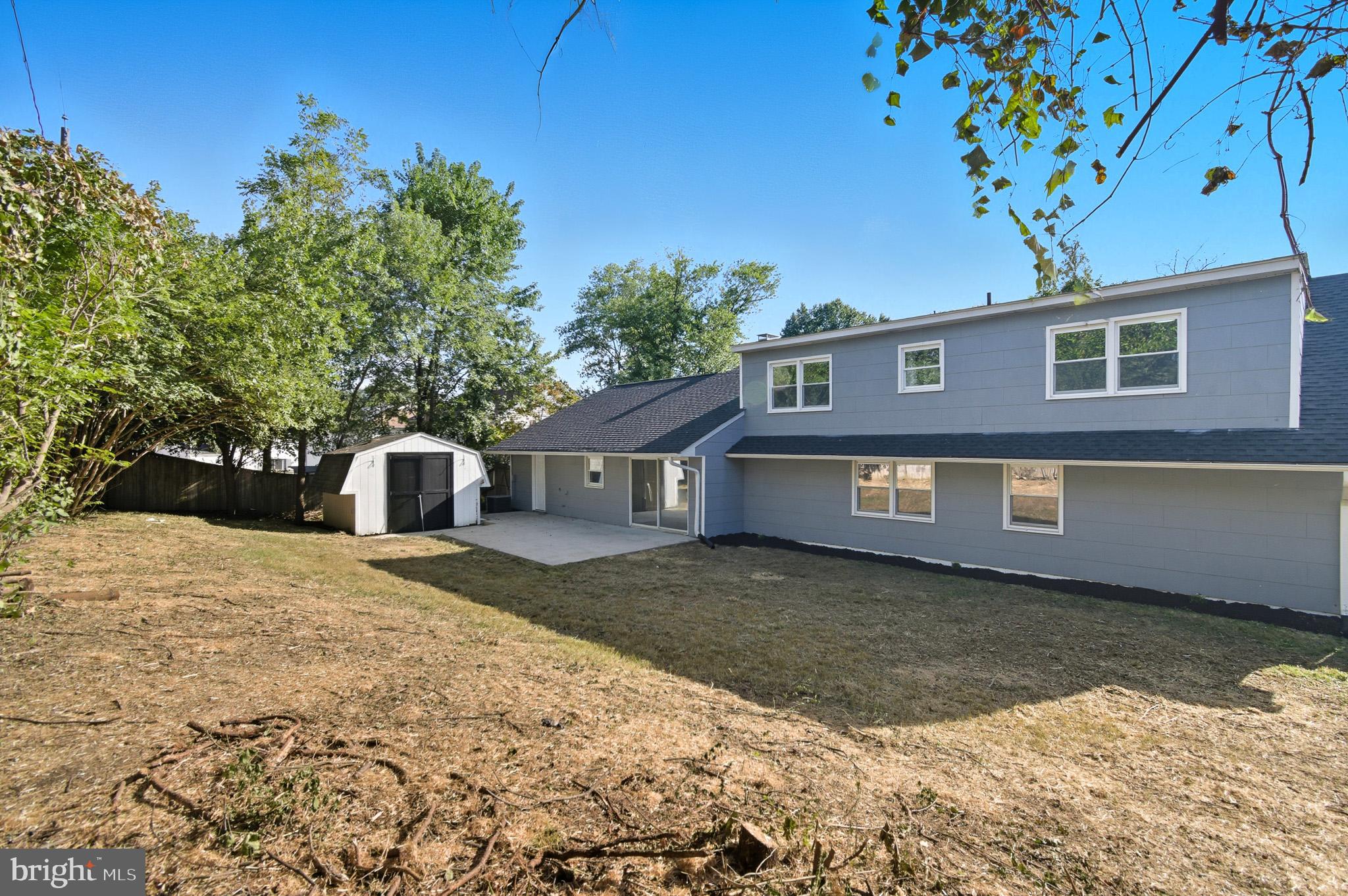 12414 Sandal Lane Bowie, MD 20715 - Photo 44 of 46 a front view of a house with a yard