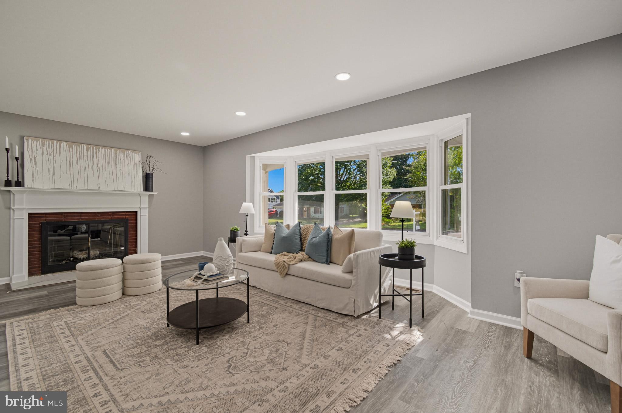 12414 Sandal Lane Bowie, MD 20715 - Photo 7 of 46 a living room with furniture and a fireplace