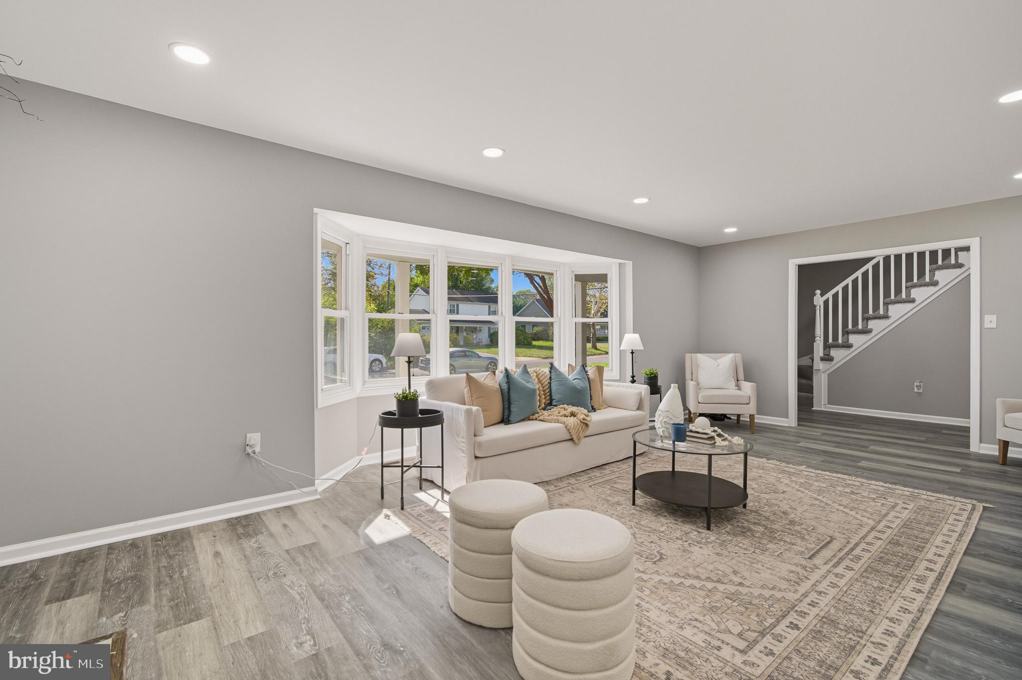 12414 Sandal Lane Bowie, MD 20715 - Photo 9 of 46 a living room with furniture and a large window