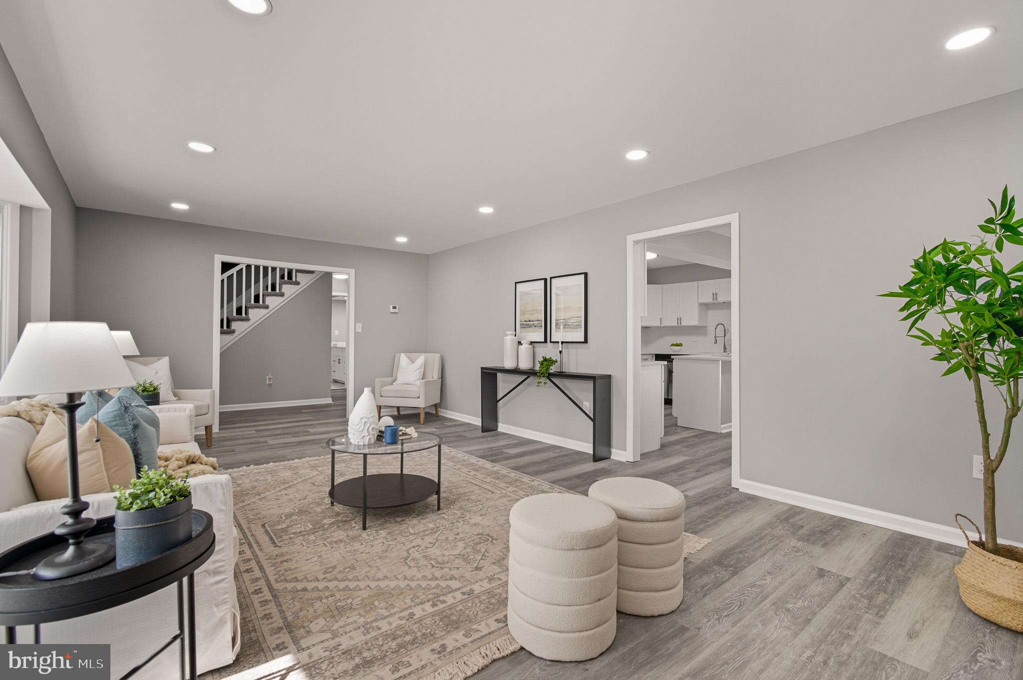 12414 Sandal Lane Bowie, MD 20715 - Photo 10 of 46 a living room with furniture and a potted plant