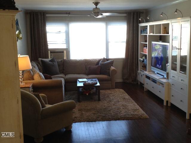 244 Glenbrook Road, Unit C Stamford, CT 06906 - Photo 1 of 1 a living room with furniture and large window