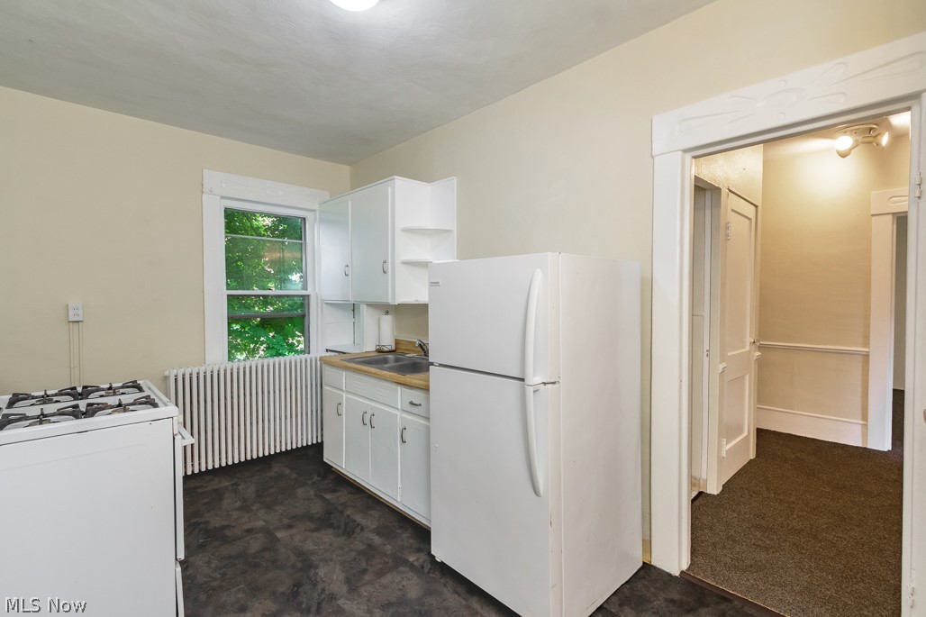 1712 Fulton Road Northwest Canton, OH 44703 - Photo 6 of 18 Refrigerator and new stove.