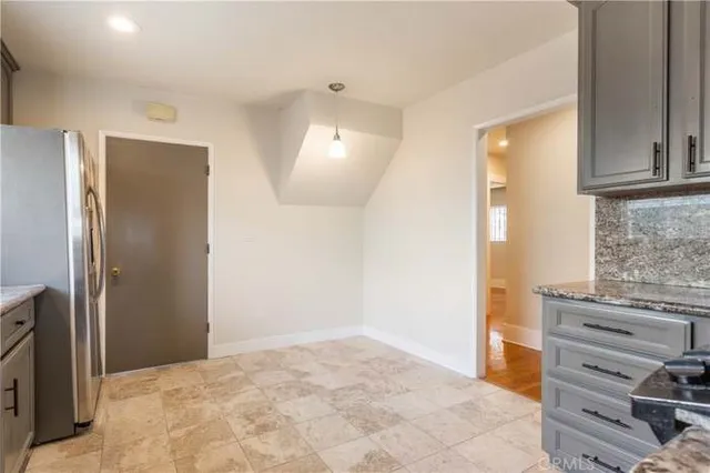 a view of bathroom with a sink and a mirror