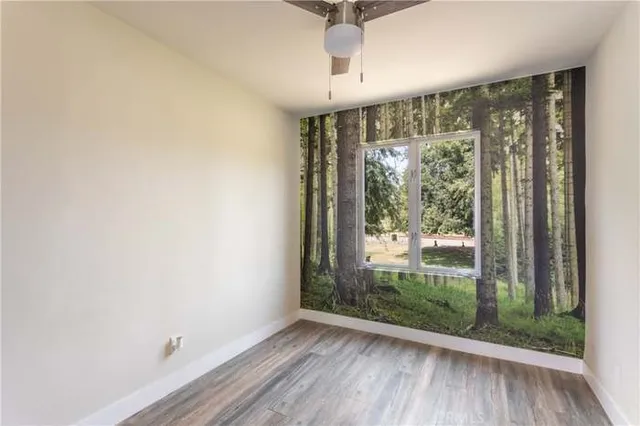 an empty room with wooden floor