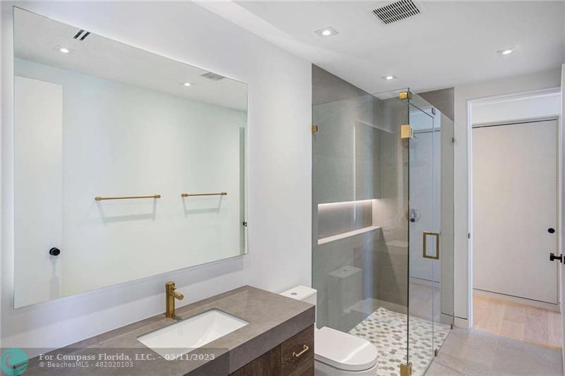 1904 Southwest 22nd Terrace Miami, FL 33145 - Photo 16 of 31 a bathroom with a granite countertop sink toilet and shower